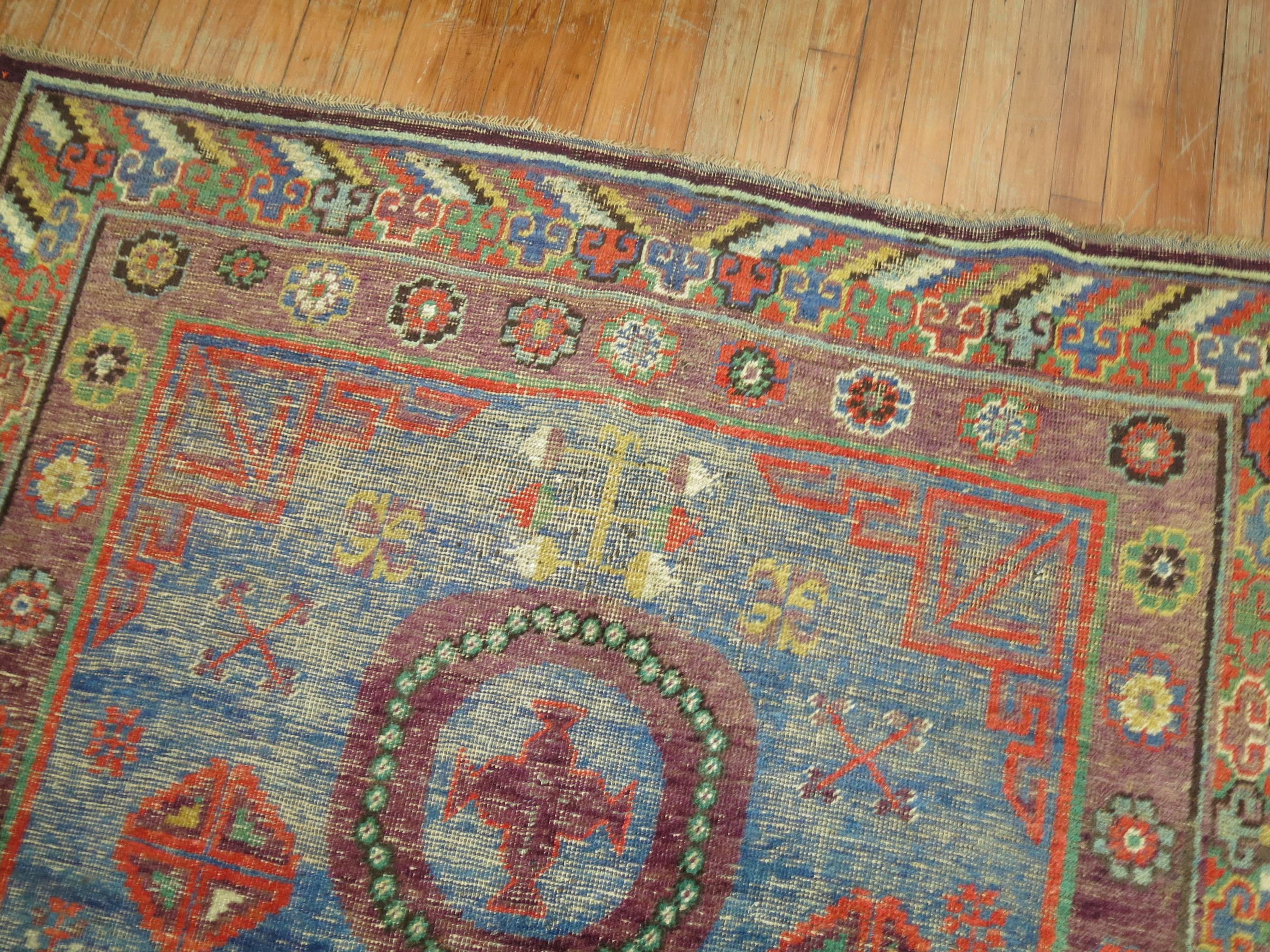 Wool Whimisical Blue Early 20th Century Khotan Antique Rug For Sale