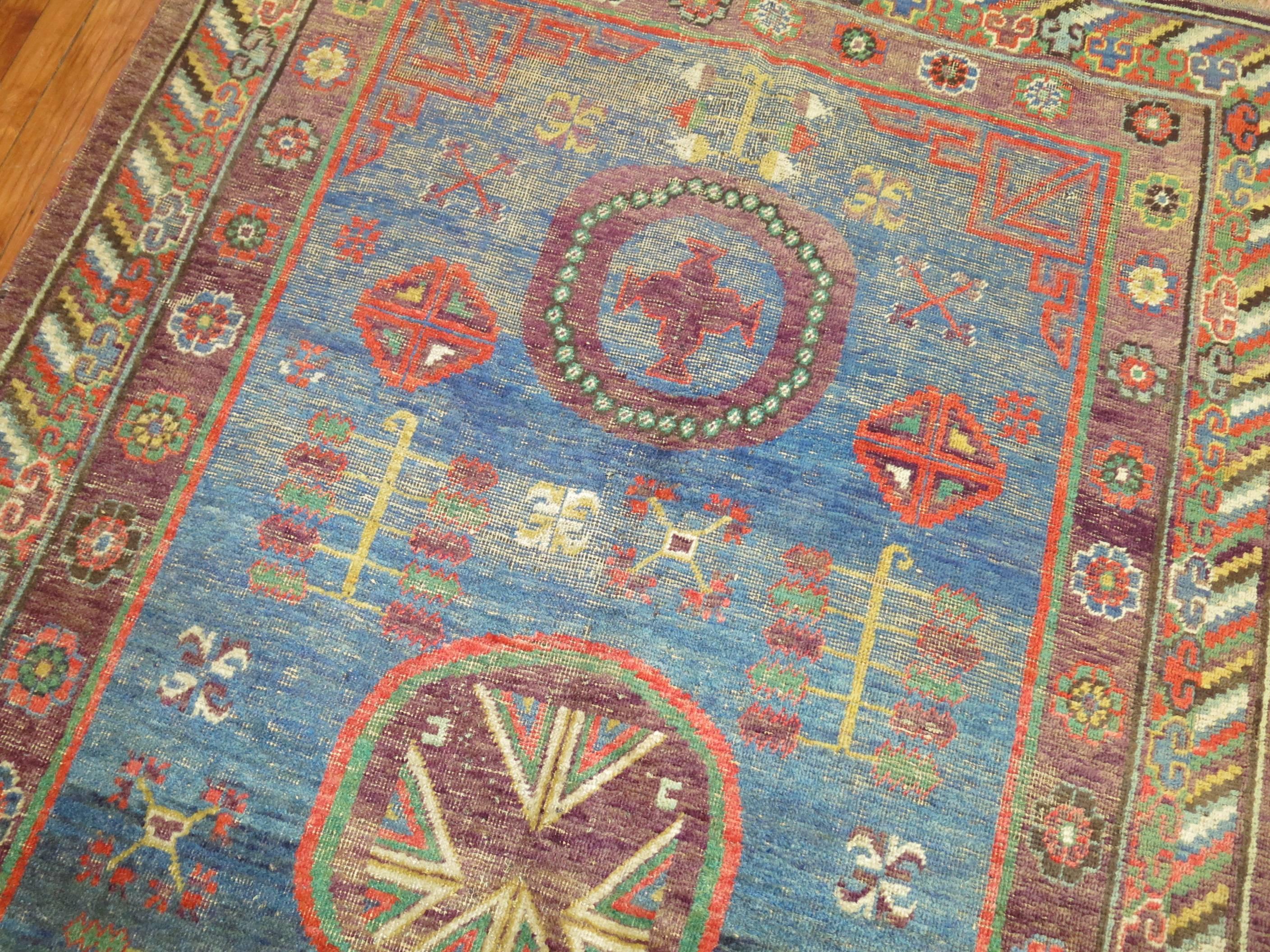 Whimisical Blue Early 20th Century Khotan Antique Rug For Sale 1