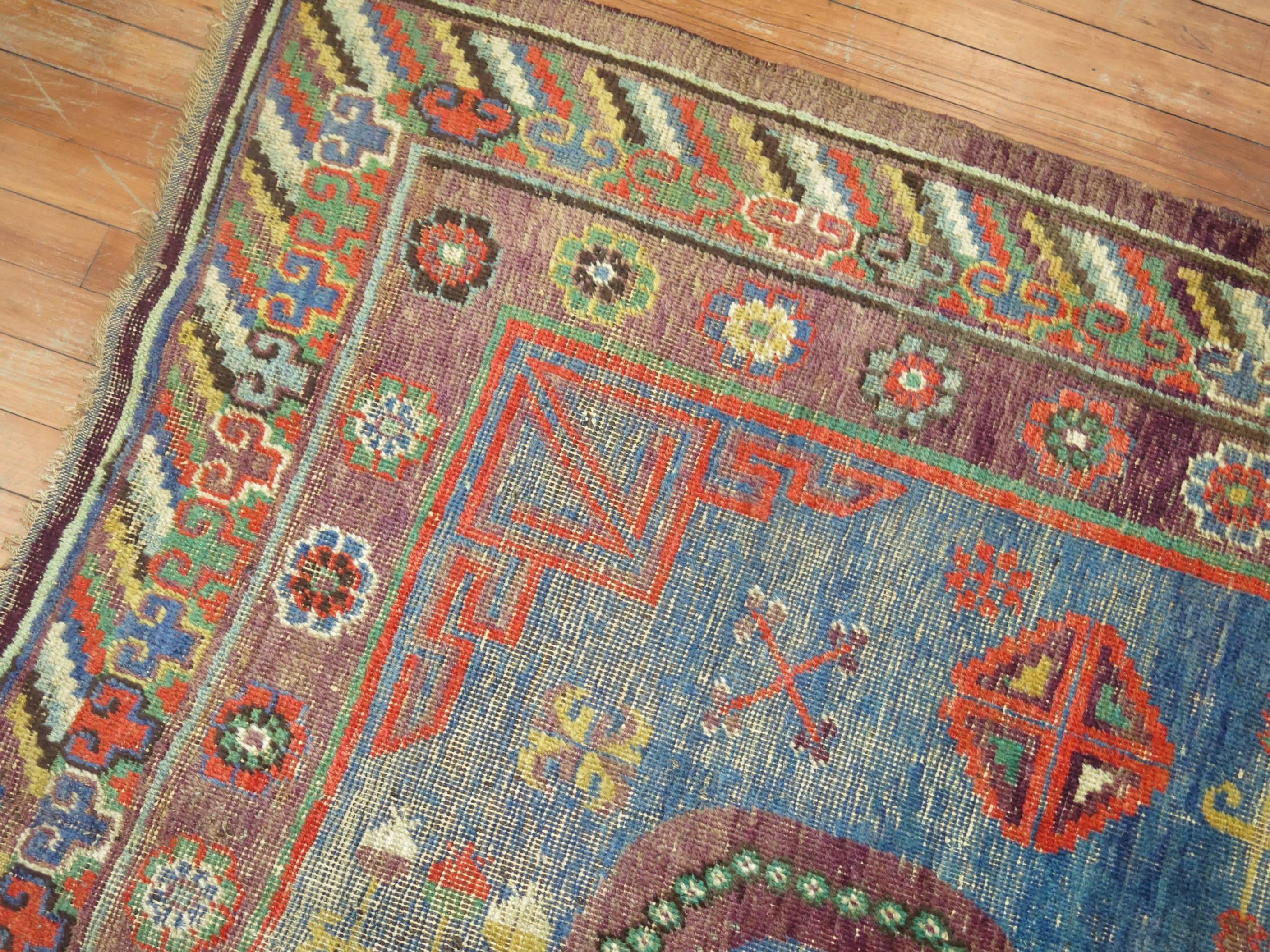 Chinese Whimisical Blue Early 20th Century Khotan Antique Rug For Sale