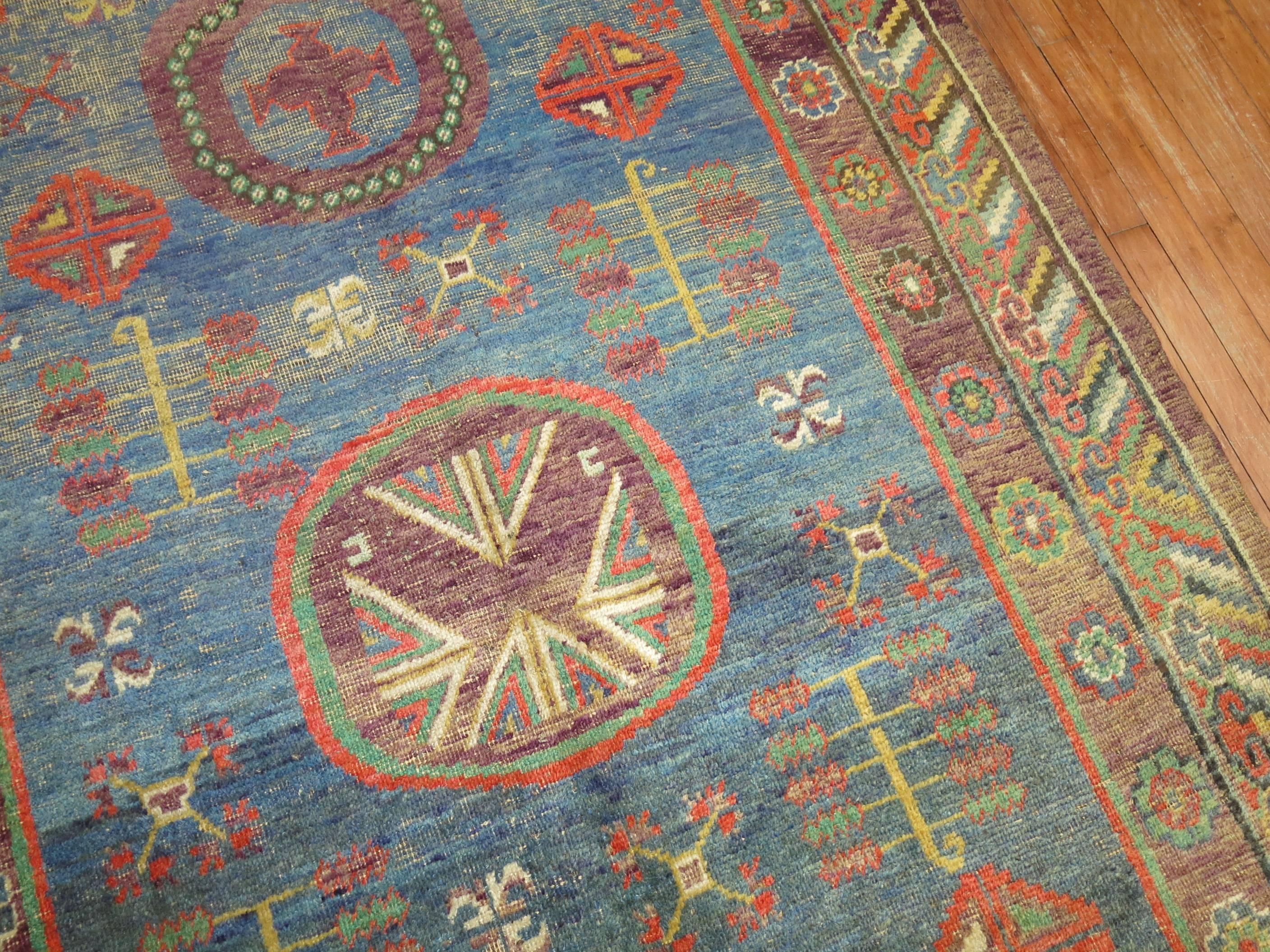 Hand-Woven Whimisical Blue Early 20th Century Khotan Antique Rug For Sale