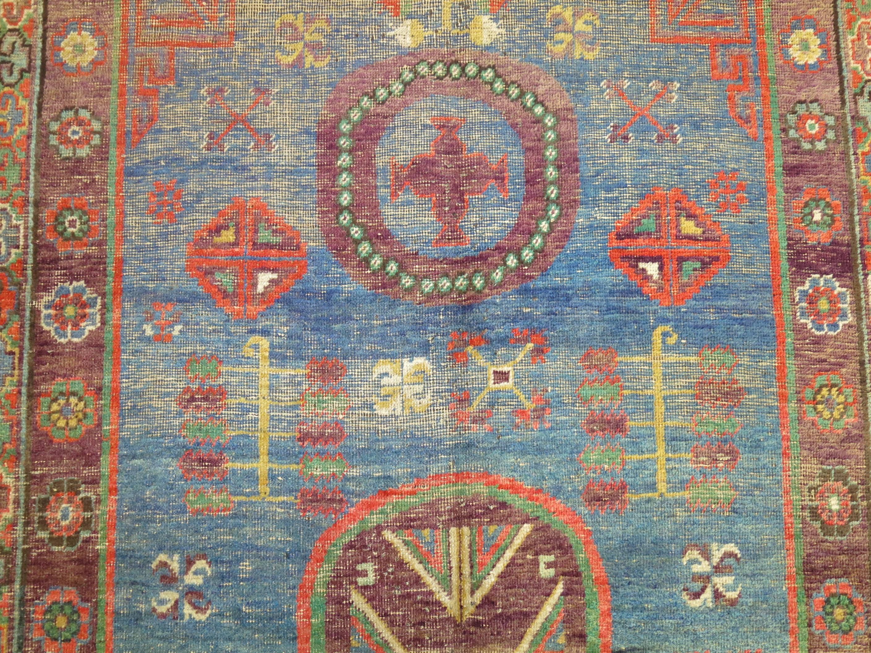 Whimisical Blue Early 20th Century Khotan Antique Rug In Good Condition For Sale In New York, NY