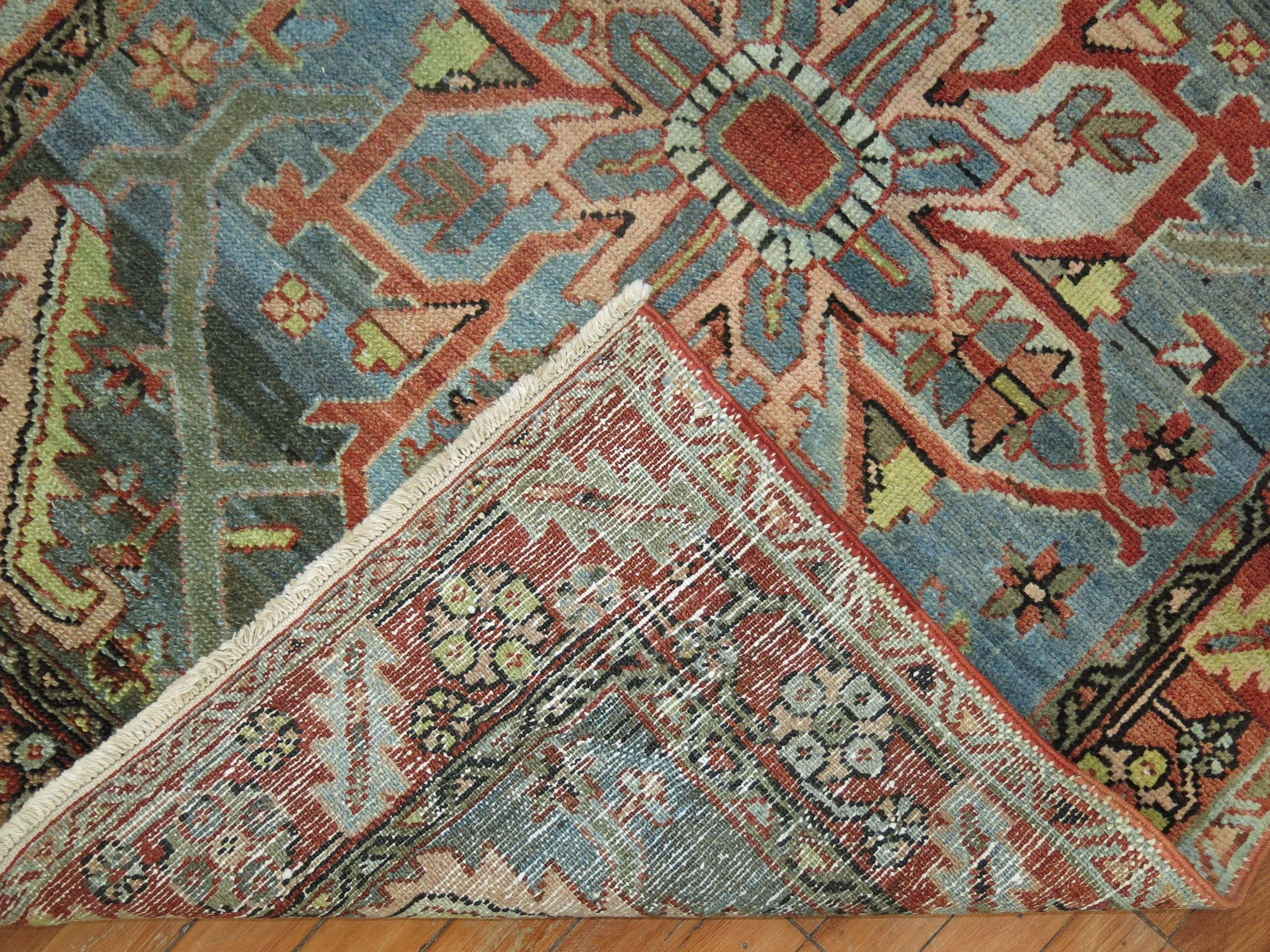 High decorative Persian Heriz rug with a rare gray-blue field tone,

circa 1920, measures: 3'6