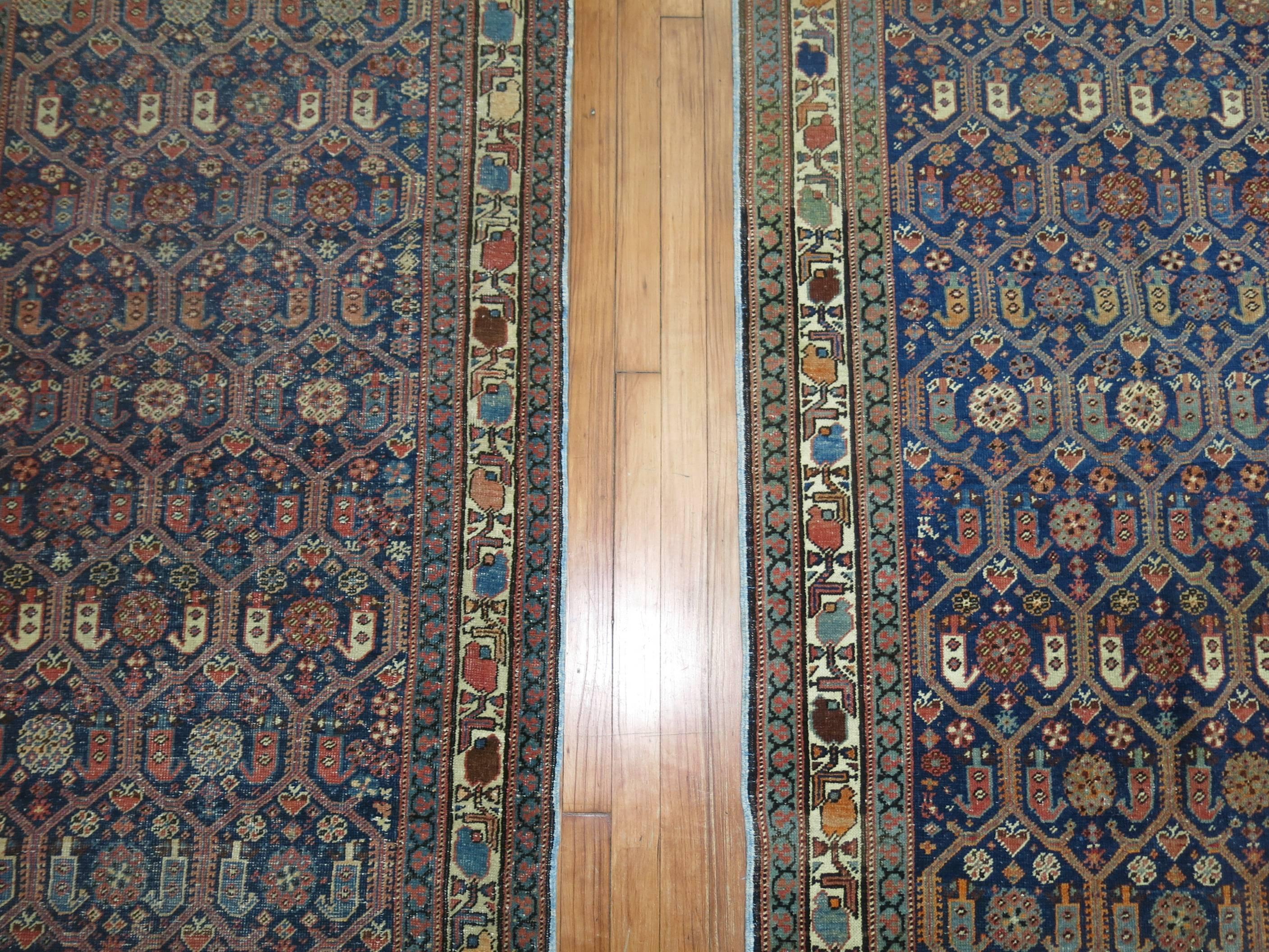 A pair of long navy blue Persian runners from the city of Malayer. Measure: 3'4'' x 17'2'' and 3'2'' x 17'4'' respectively.

Can be sold individually if needed.