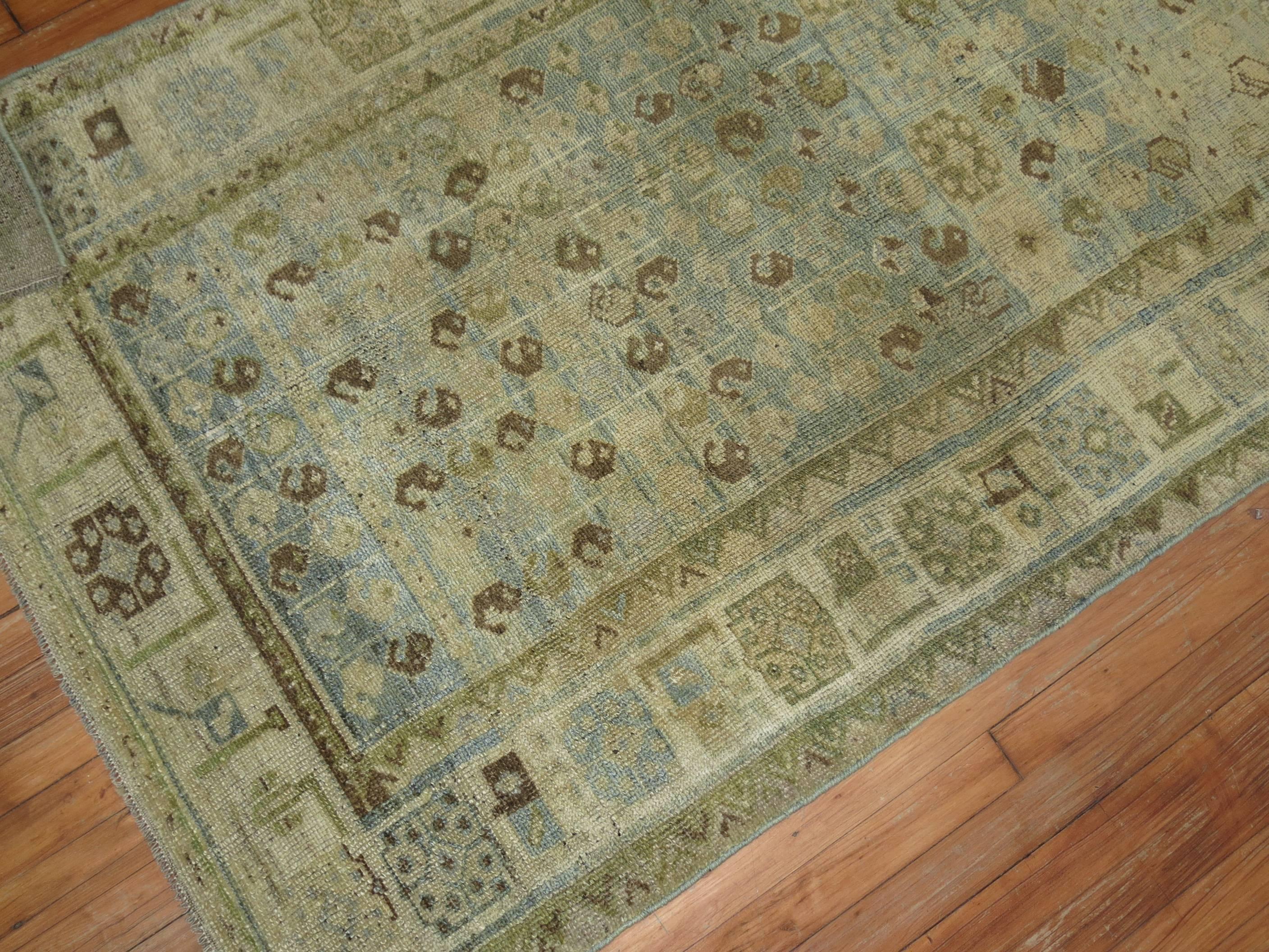 A stunning Persian Malayer rug in ocean blue tones with a small paisley motif. Accents in green and brown too, circa 1920.

Measures: 3'8