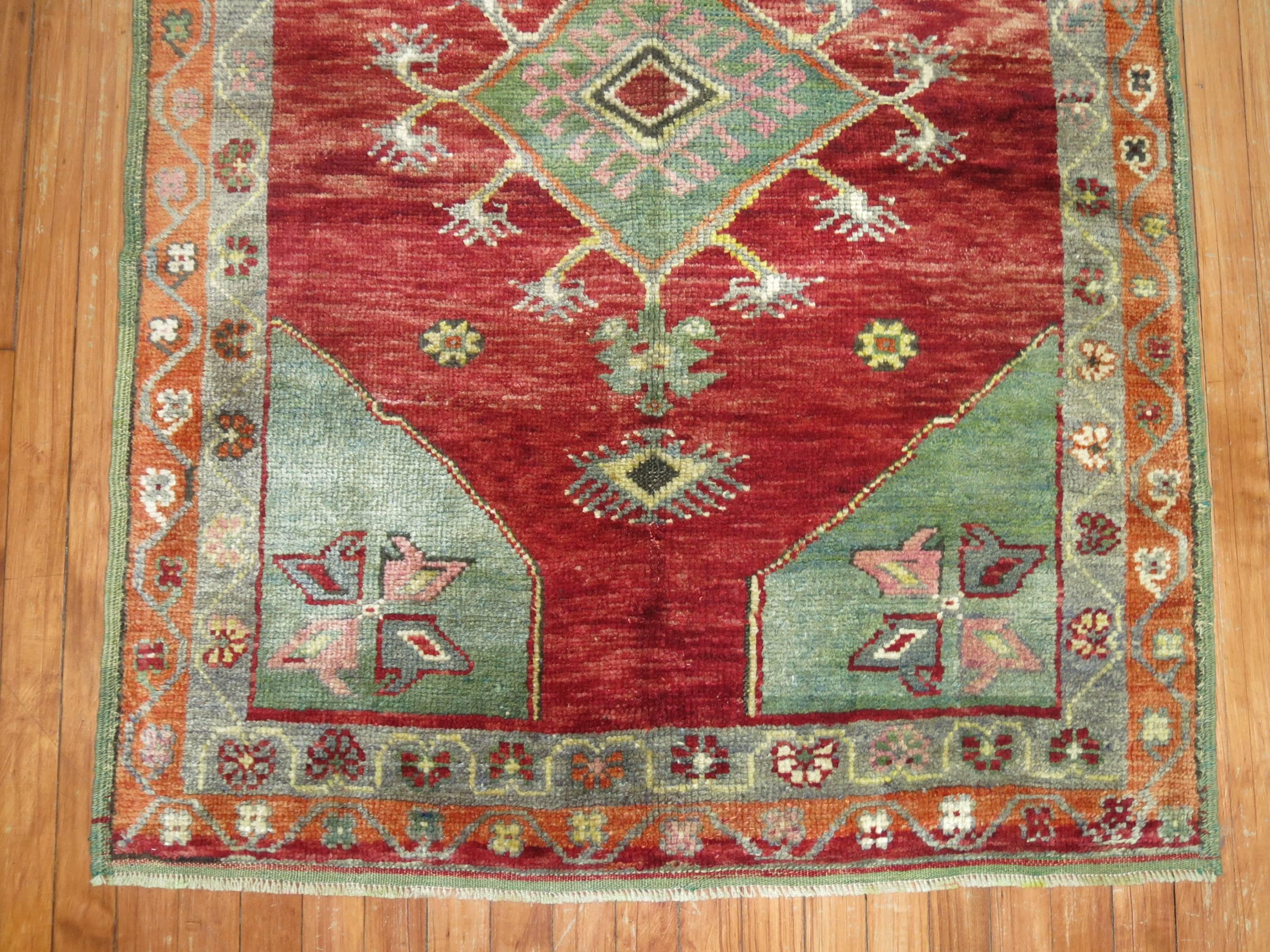 Vintage Turkish Oushak Rug in bright reds and greens.

3'6'' x 5'