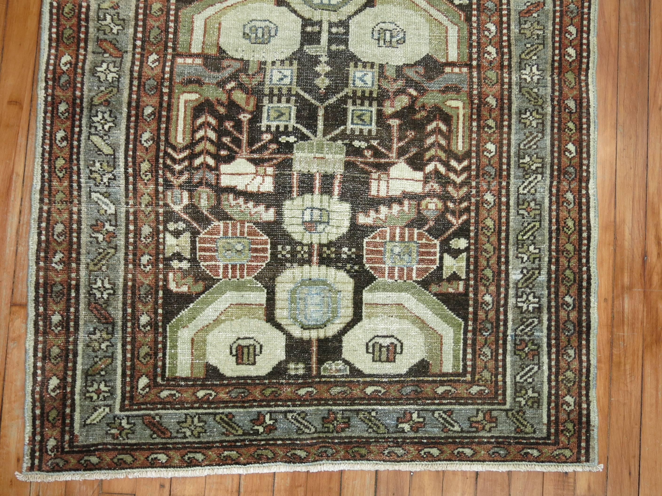 An early 20th century Persian Malayer rug in earth tones.

Size: 3'3