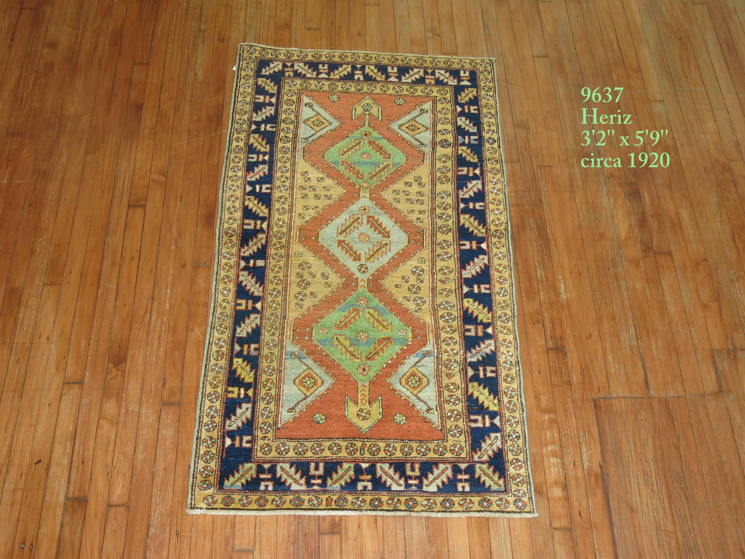 Colorful Persian Heriz Rug featuring a bright green accent color we seldom find. 

Heriz carpets are beloved for their versatility. Their geometry complements modern furnishings and their warm colors and artistic depth enhances antiques of all
