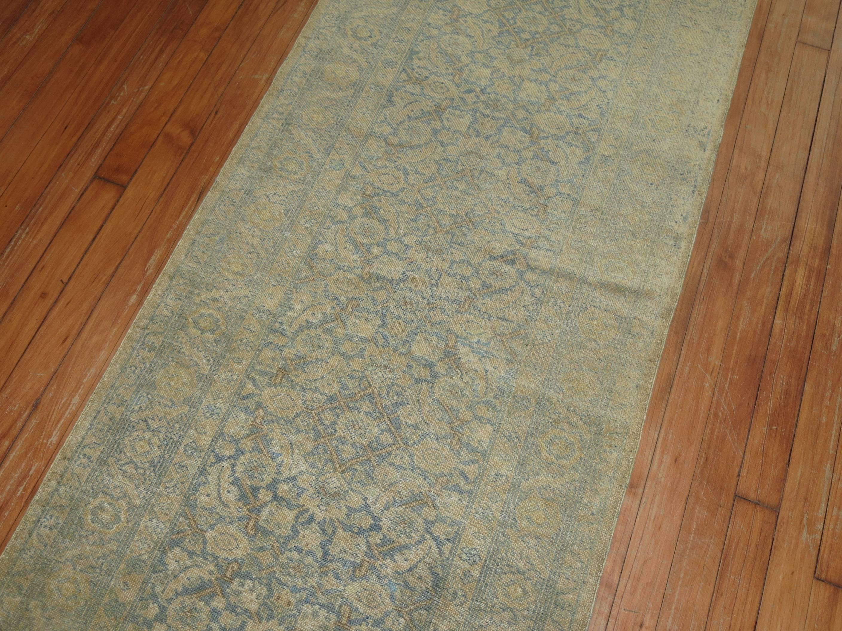 Early 20th Century Narrow Pale Blue and Gold Handmade Persian Tabriz Runner For Sale
