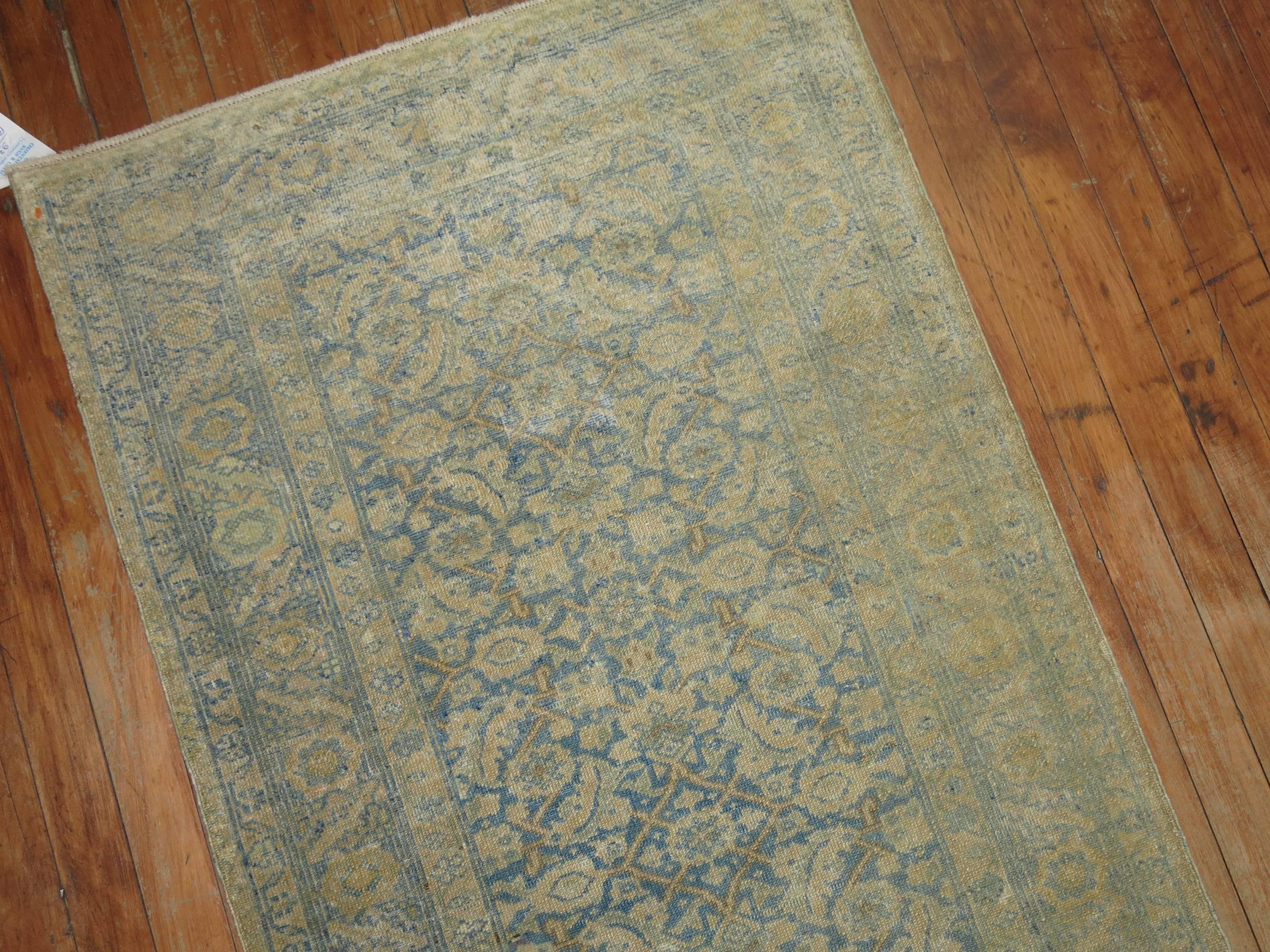 Finely woven narrow and long Persian Tabriz runner in very pale blues and gold,

circa 1910, measures: 2'4