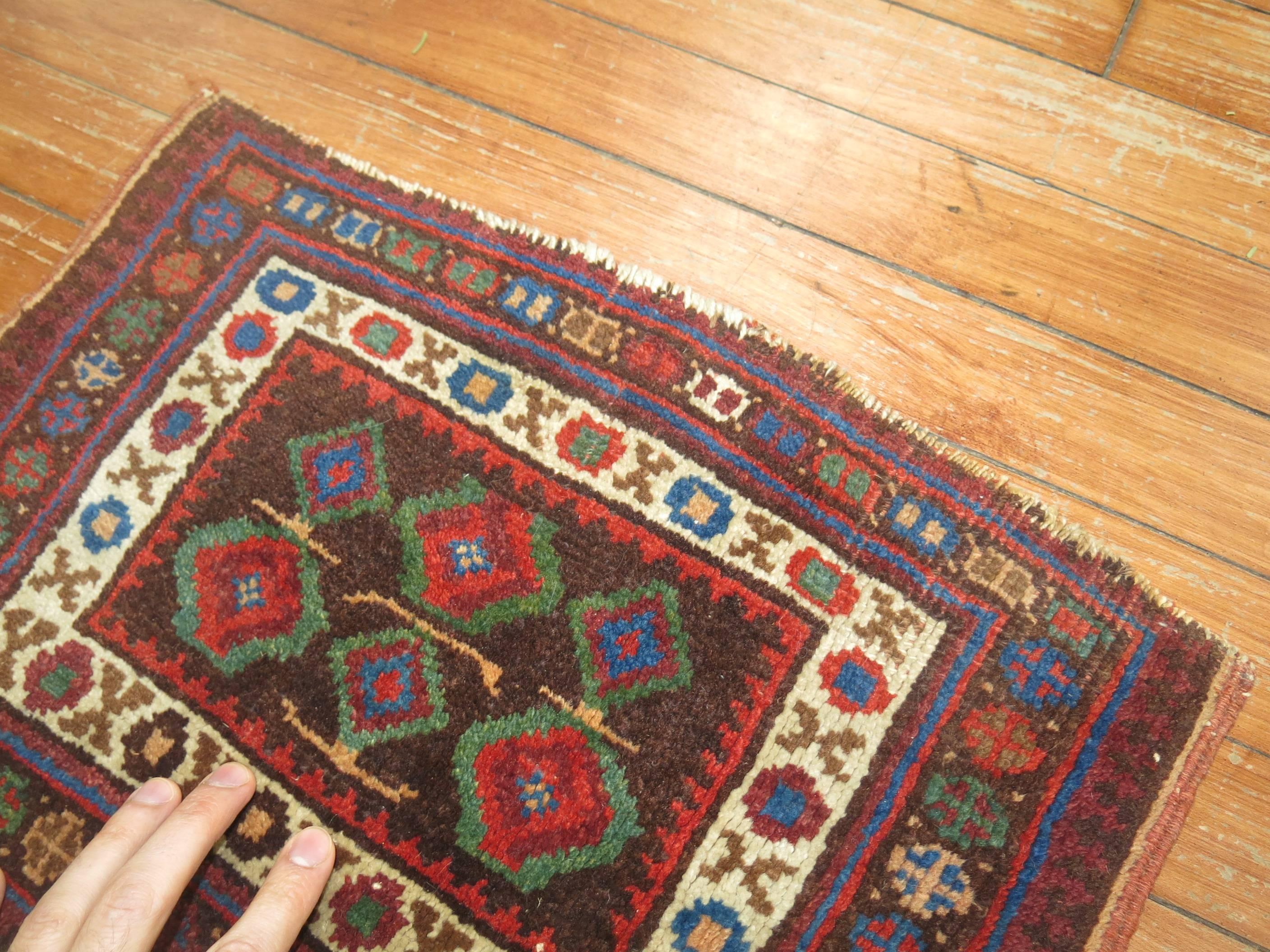 An early 20th century Persian Afshar Small throw rug.

1'1'' x 1'6''