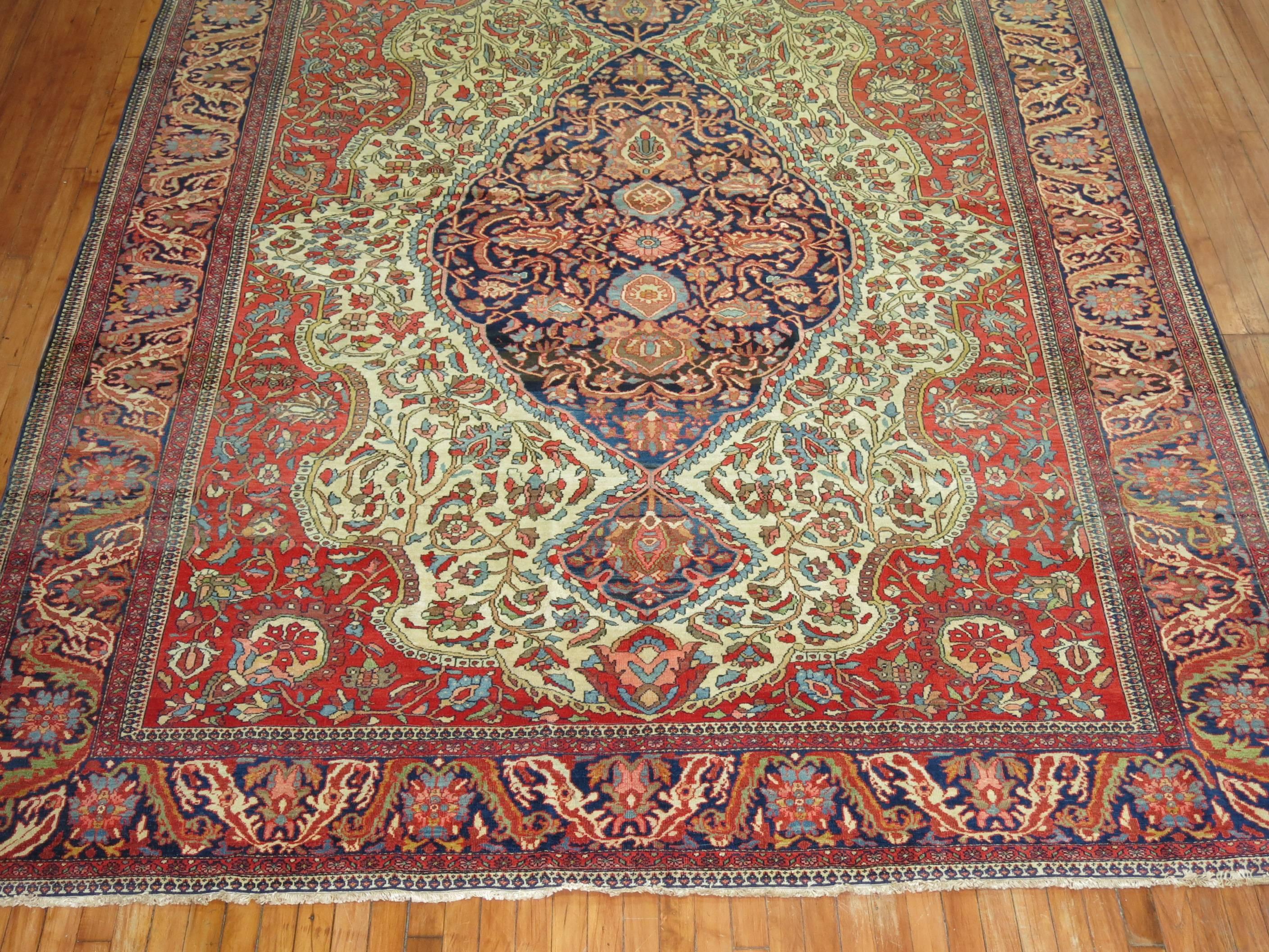 An authentic early 20th century Sarouk Ferahan carpet with classic medallion and border design. 

Investment-level Ferahan rugs were not produced after the 1910s, and the finer 19th and turn-of-the 20th century examples have become quite rare. The