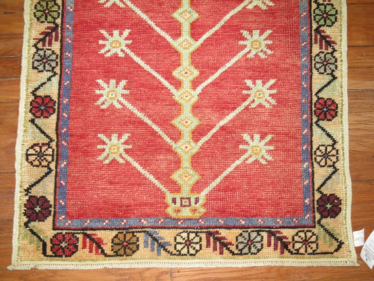 A mid-20th century one of a kind Turkish Anatolian rug featuring a prayer niche motif.

Size: 2'9