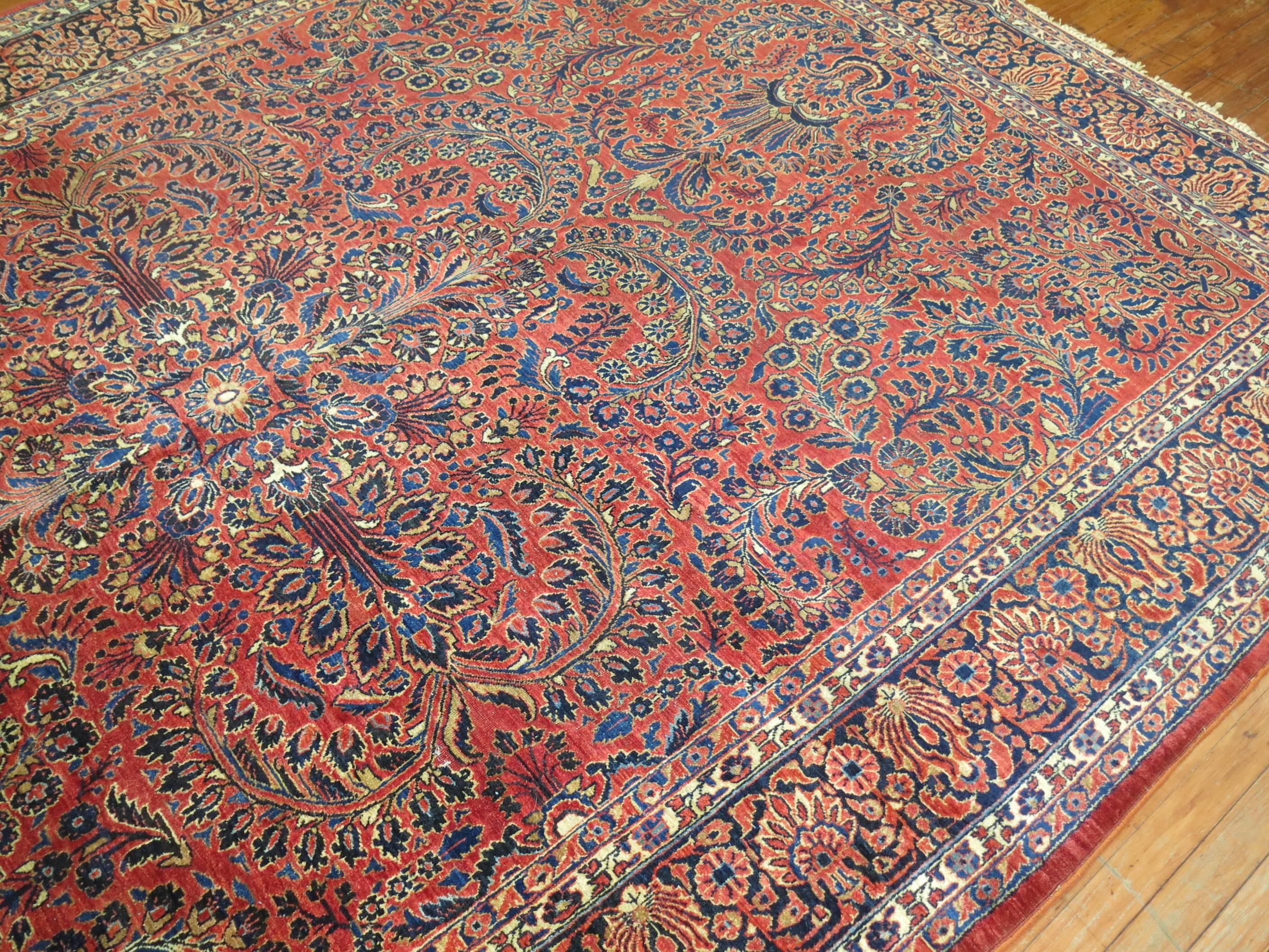 An authentic room size full pile antique Persian Sarouk rug.

Measures: 7'10'' x 11'9''.