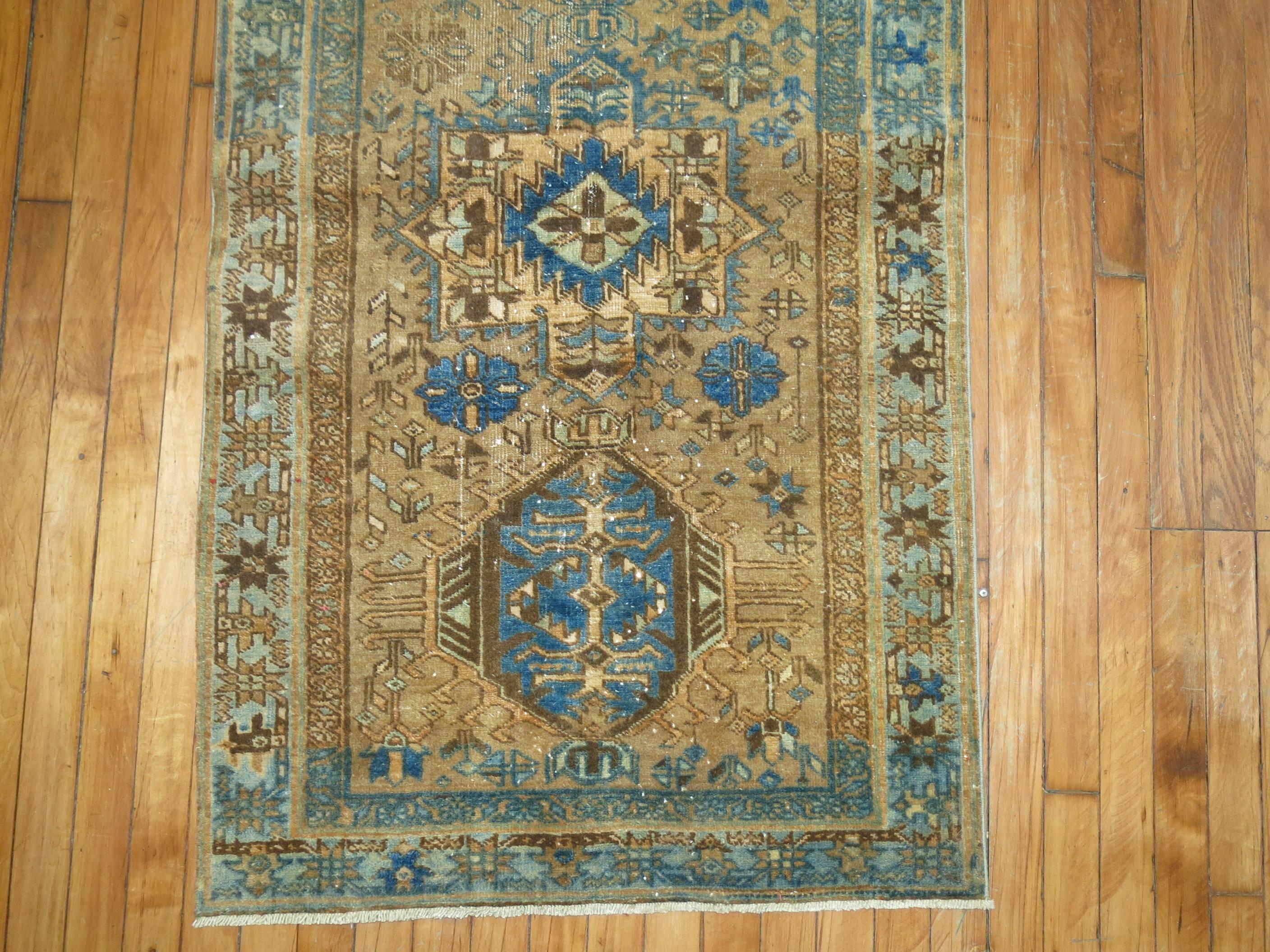Persian Heriz scatter size rug in brown, camel and blue.

2''8'x 4'6''