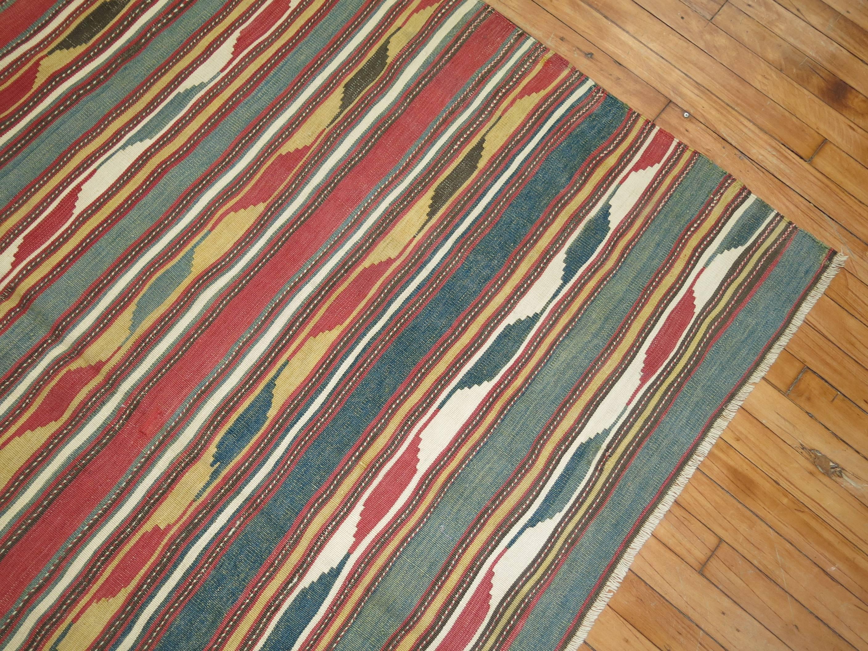 A handmade tribal Kilim with beautiful array of colors.

Measures: 5'10
