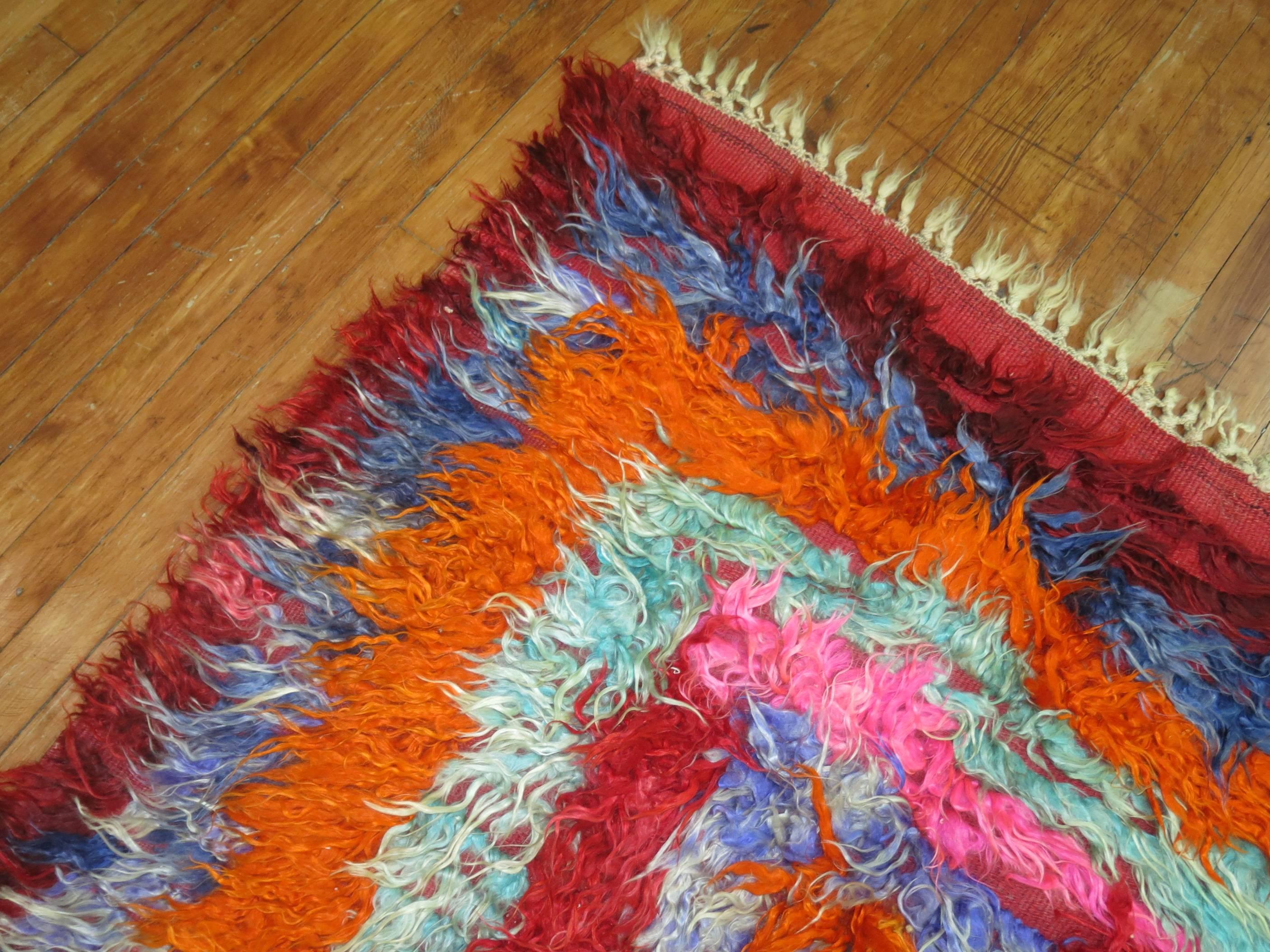 An electrical colored mid-20th century Turkish Tulu Shag Yatak rug. These type of rugs were originally woven to be used as beds. Nowadays these are used as floor coverings, primary for apartment lofts. Very cozy and definitely has a boho