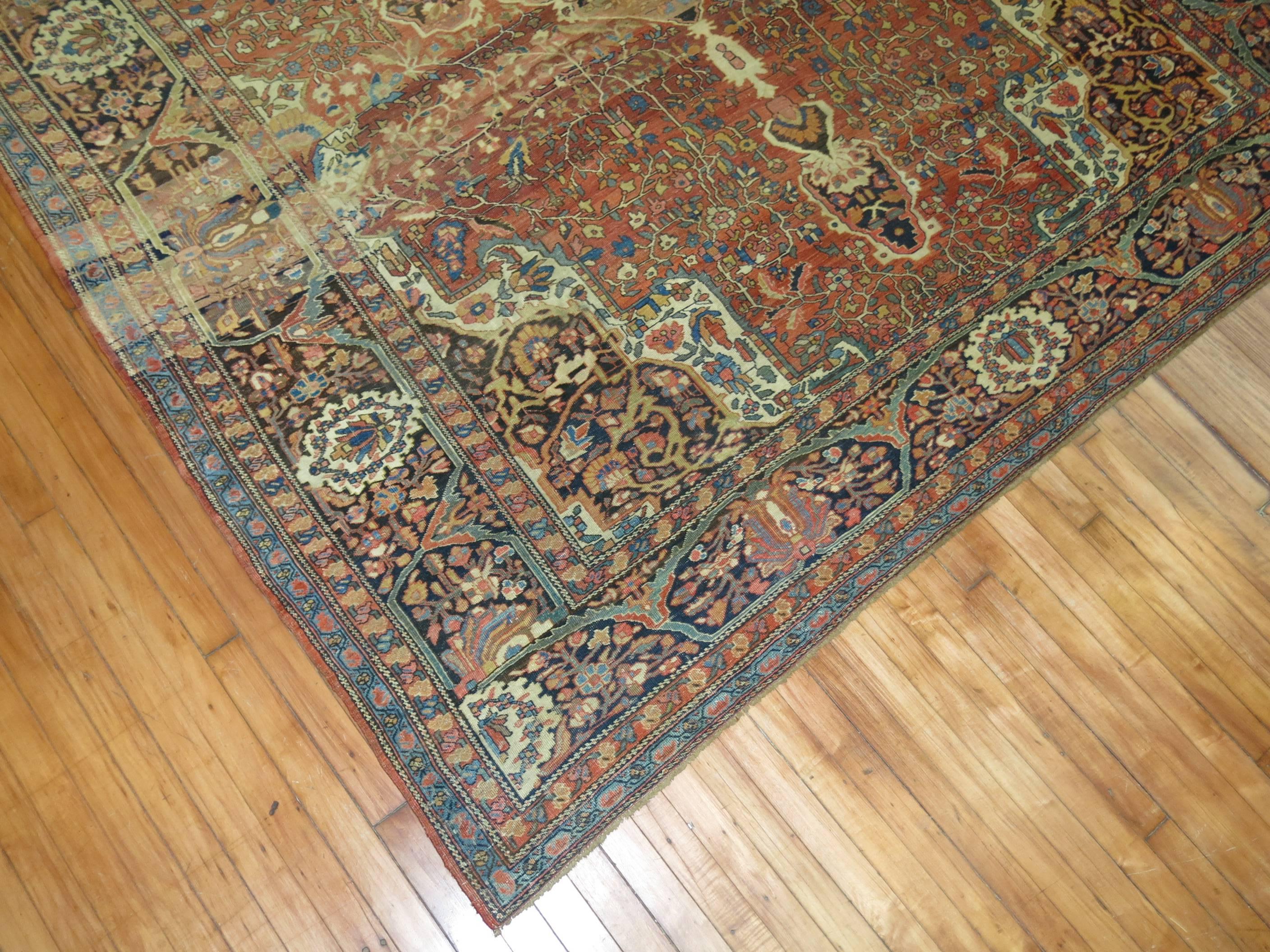 Beautifl abrashes highlight this early 20th century Antique Persian Sarouk Ferehan. Rust Background with pretty shades in predominant blue and brown accents

Measures: 8'7'' x 11'7''

The art of streaking color, a technique known as abrash, was