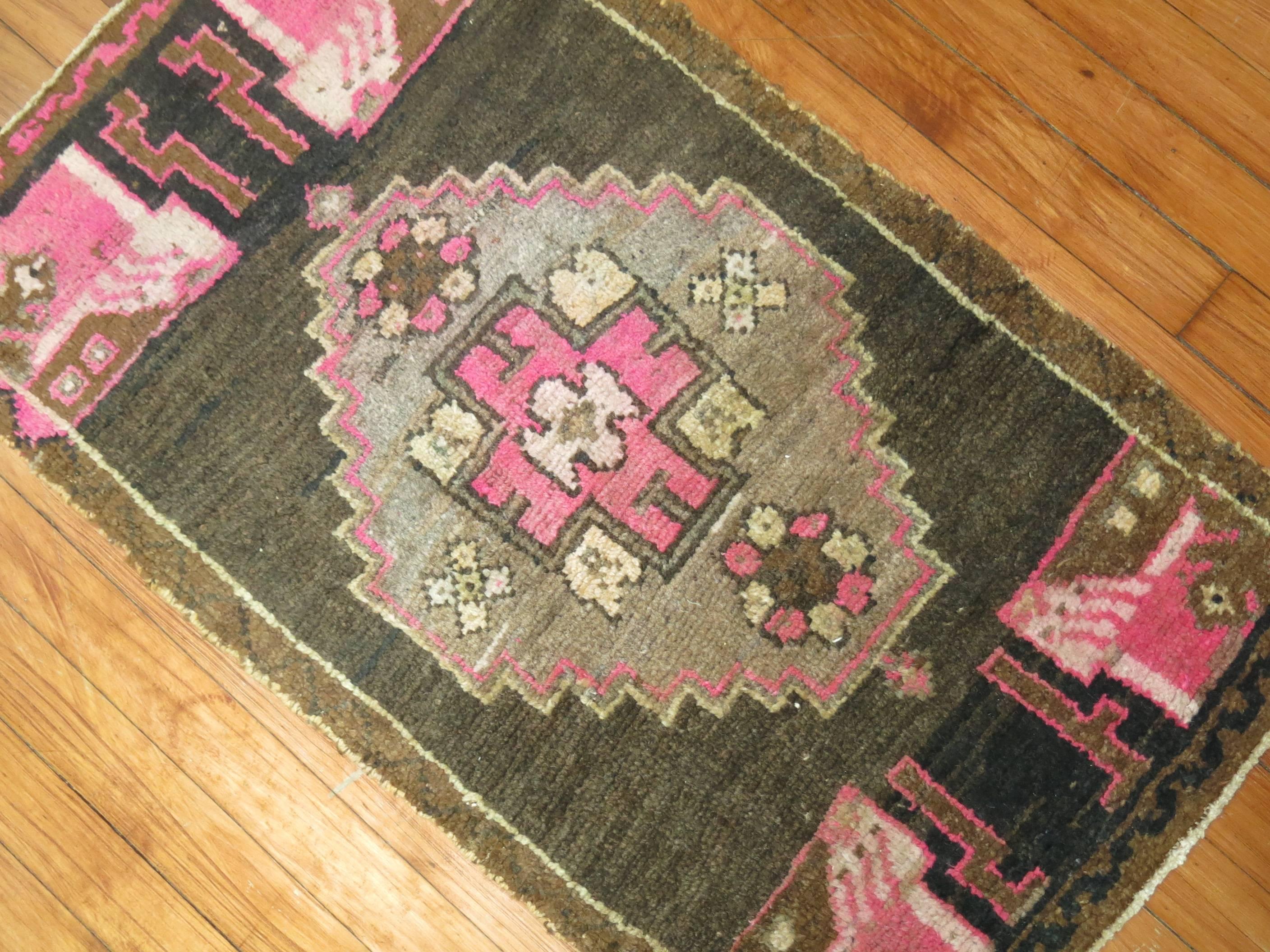 Vintage Turkish Oushak rug in chocolate brown and pink.