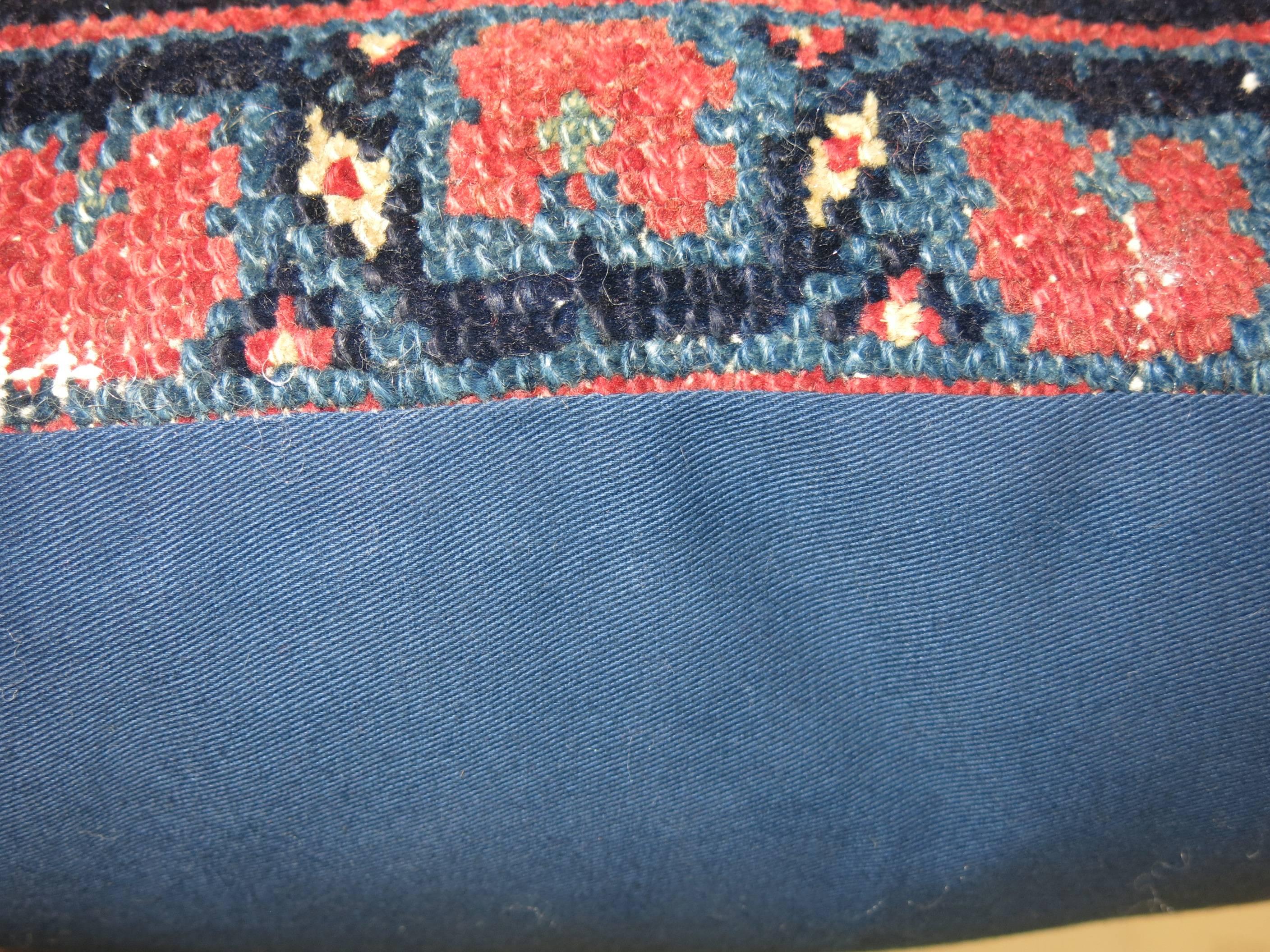 Pillow made from a Mahal rug with blue cotton back. Zipper closure. Age wear.