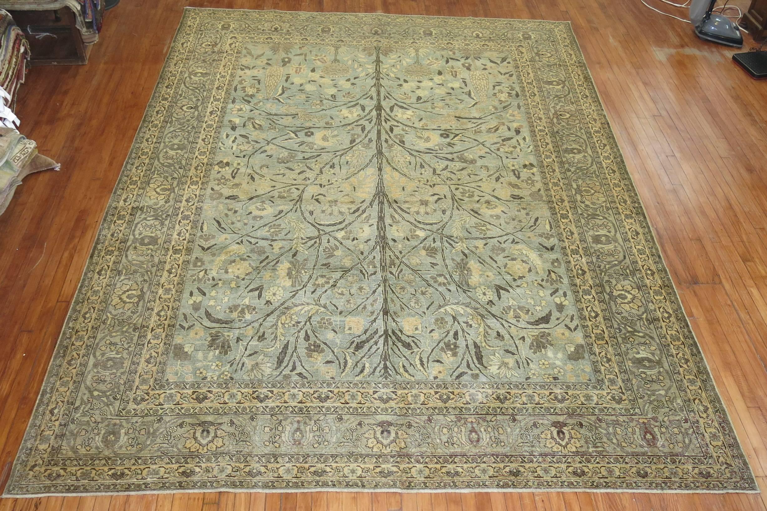 An early 20th century, Persian Tabriz with a Garden of Paradise Design in sea foam colors.