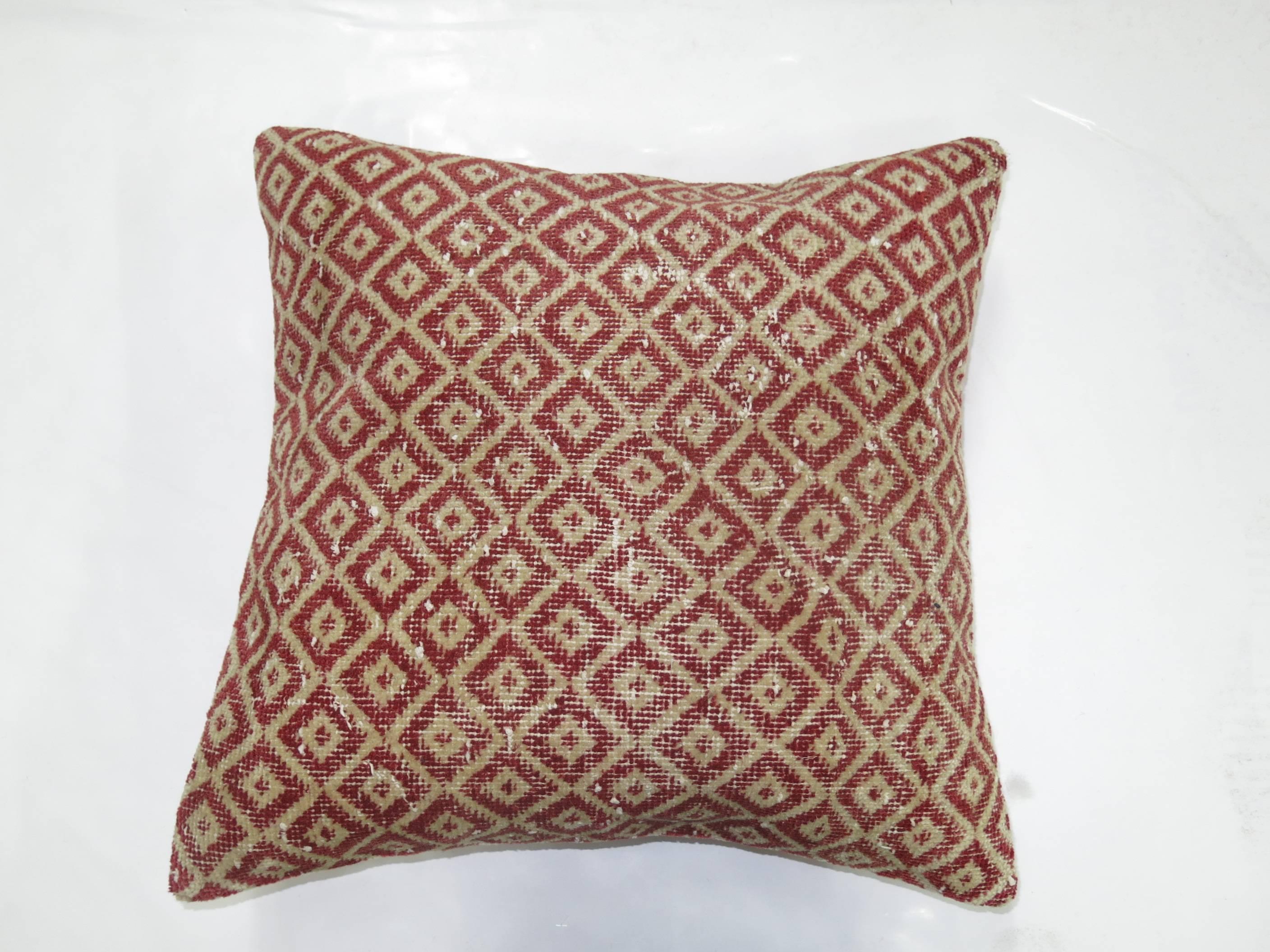 Pillow made from a Turkish Konya rug with pink linen backing and zipper closure.

17'' x 17''