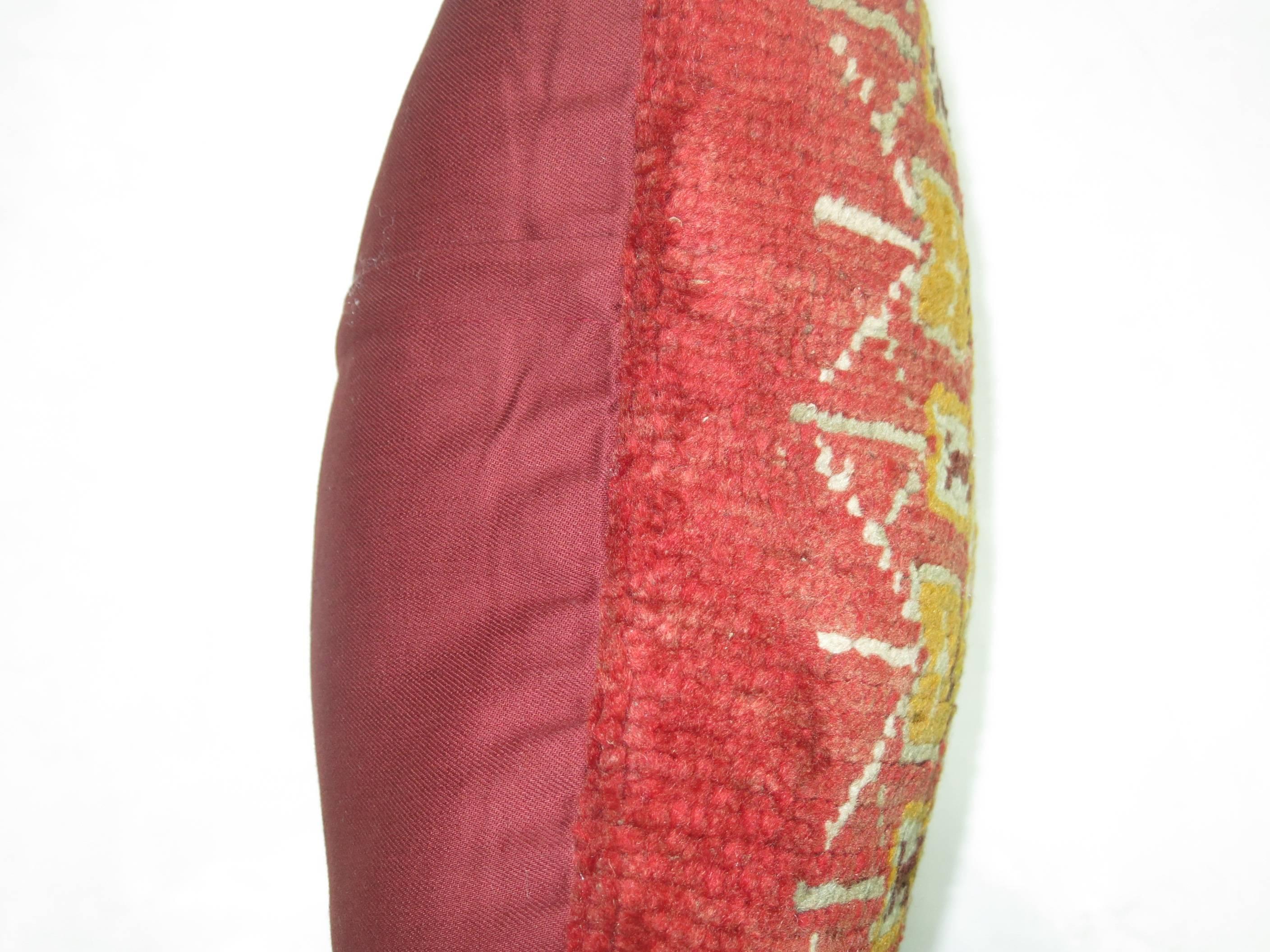 Pillow made from a richly colored antique Turkish Oushak rug.