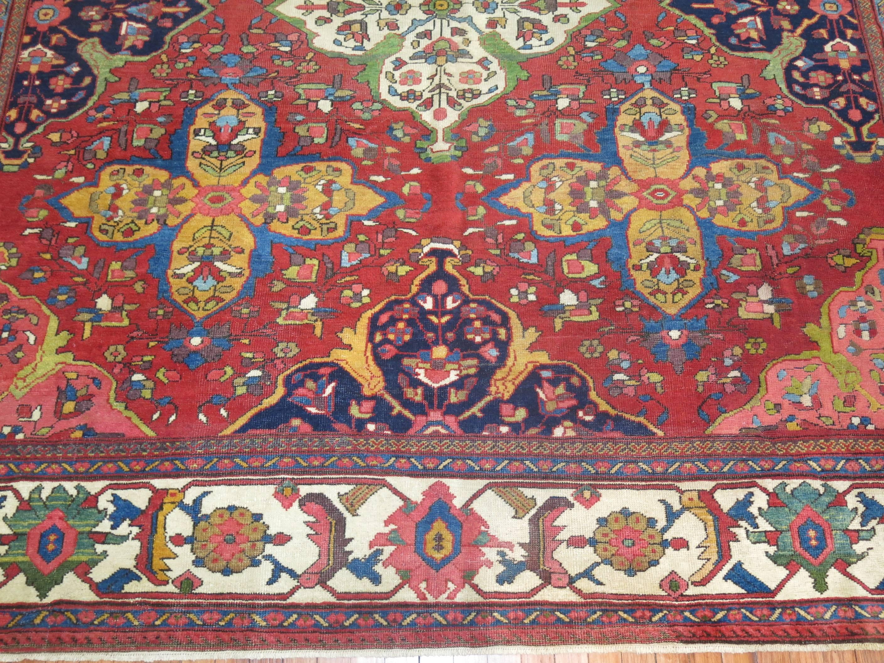 Rich colored Persian Ferehan rug with bold large scale all-over motif. Great rug to start a room around. If you appreciate and old antique rug and the beauty and craftsmanship then this could very well be the one!

Measures: 9' x 12'2