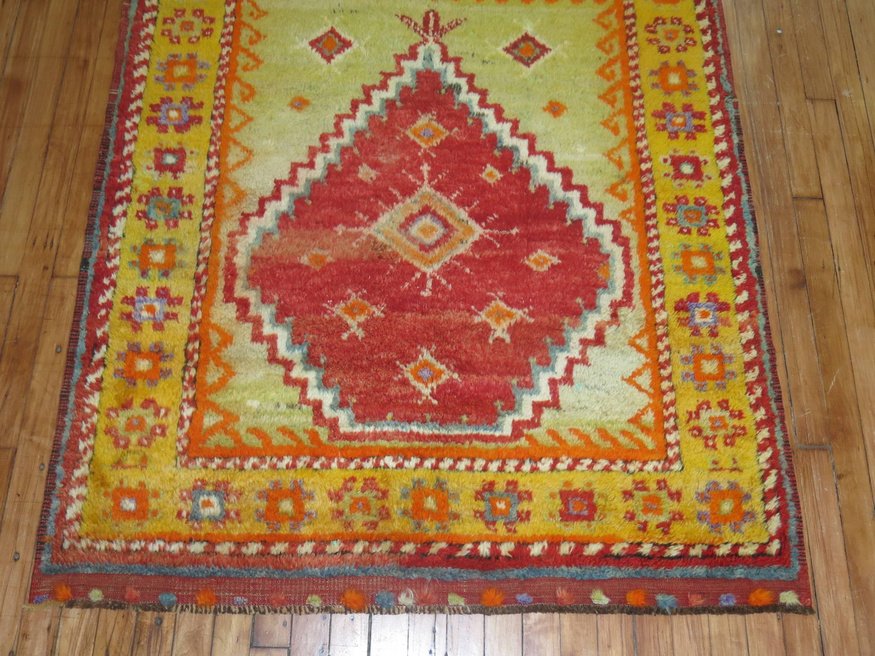 A Turkish Tulu prayer rug with saturated colors in predominant red. Lime green and orange tones

Measures: 4' x 4'9