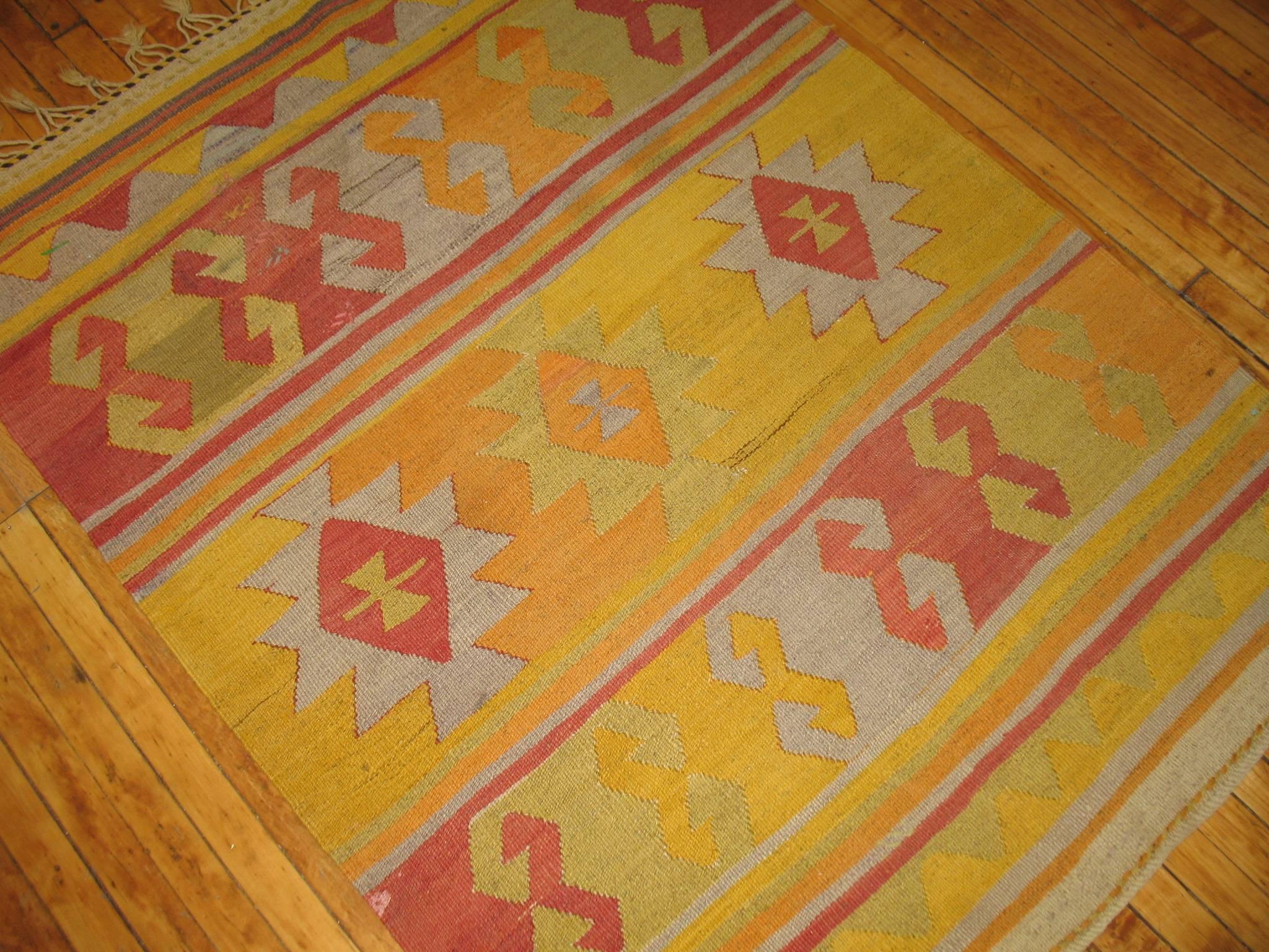A vintage Kilim flat-weave in sunny yellow.