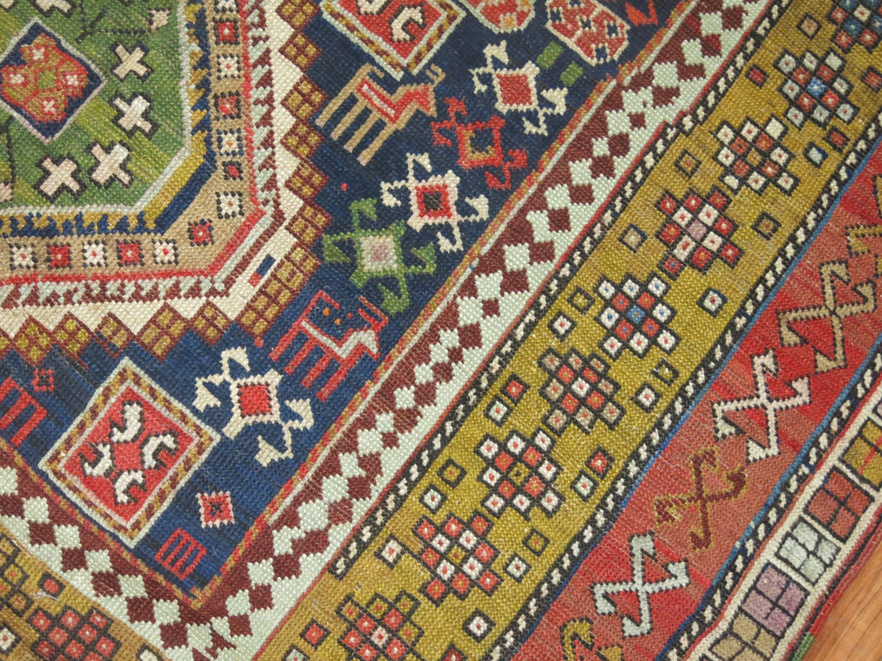 An early 20th century Shirvan rug woven in the villages of the Caucuses. 5 colorful medallions on a navy ground. Geometric, Casual, crisp are best way to describe this rug

Measures: 4'7'' x 9'.
