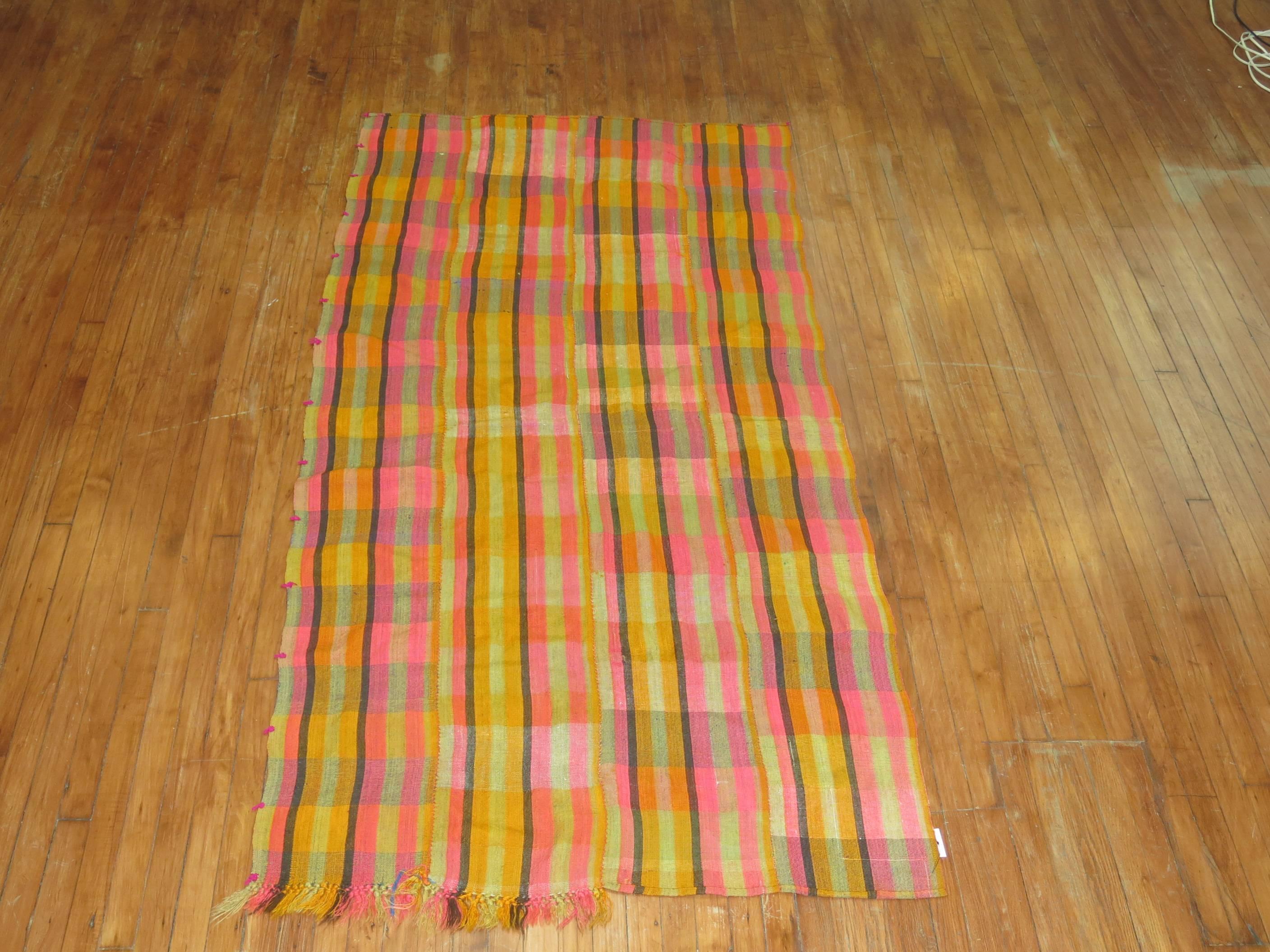 Colorful Turkish textile that can be used as a floor covering or throw.