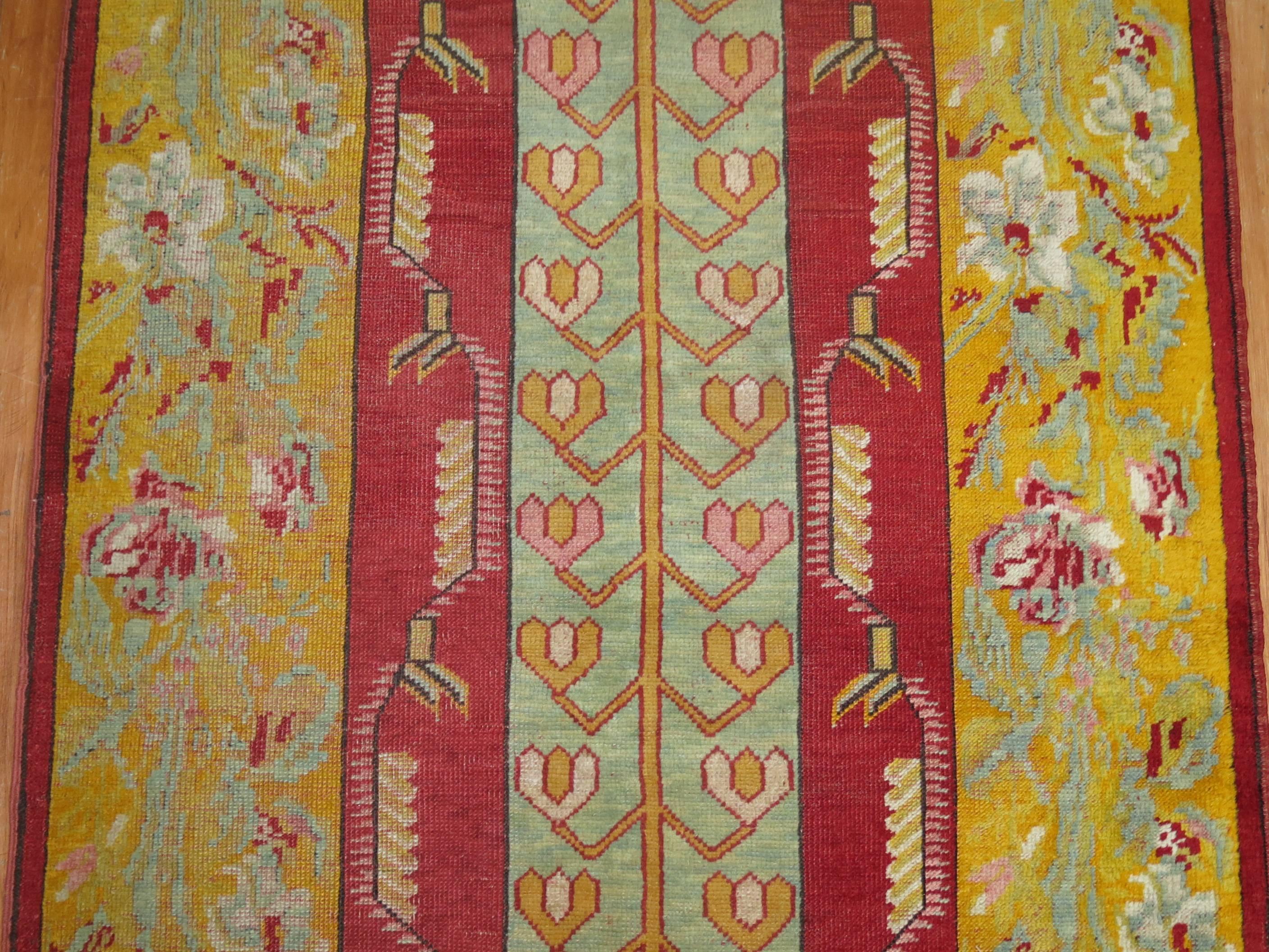Fine quality bright Turkish runner with an elegant vertical floral motif. Bright red, powder blue, yellow accents,

circa 1920, measures: 3'5