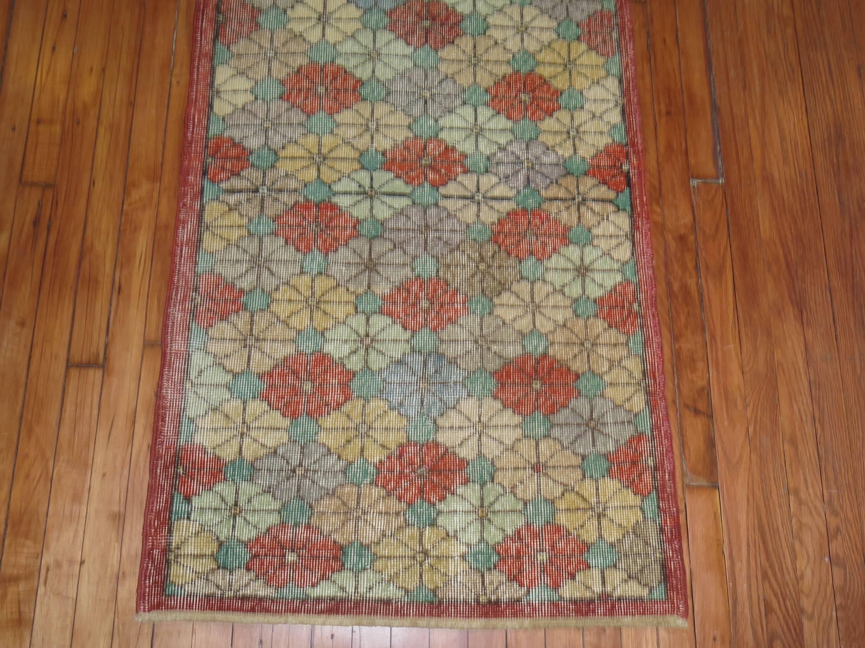 A shabby chic Turkish runner with an all-over floral design.

2'8'' x 7'1''