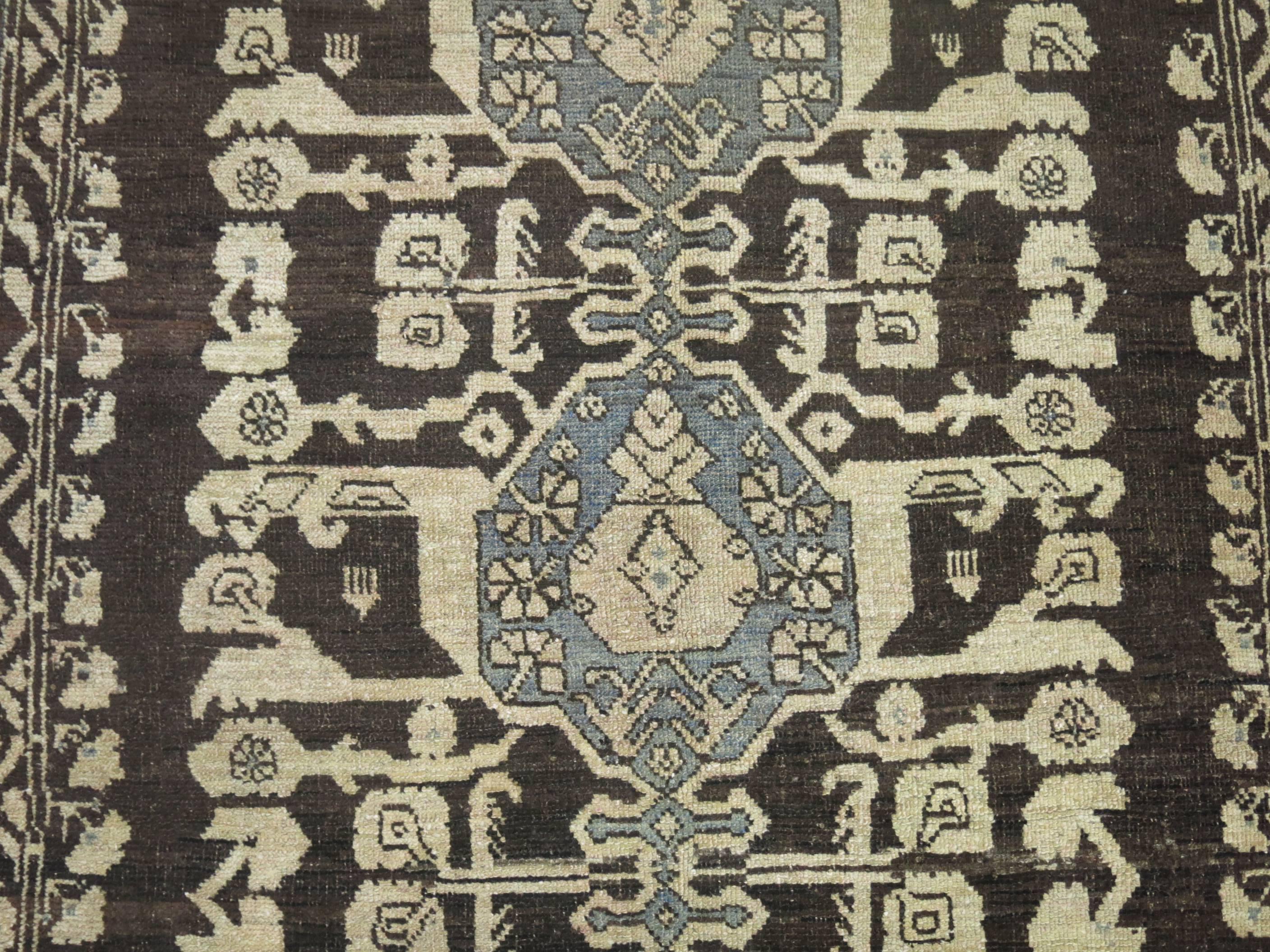 The town of Kula, was one the most prolific weaving centers in the country of Turkey for centuries. The charcoal background makes this rug very decorative and the peculiar motif is a characteristic of this group of rugs woven in turkey.