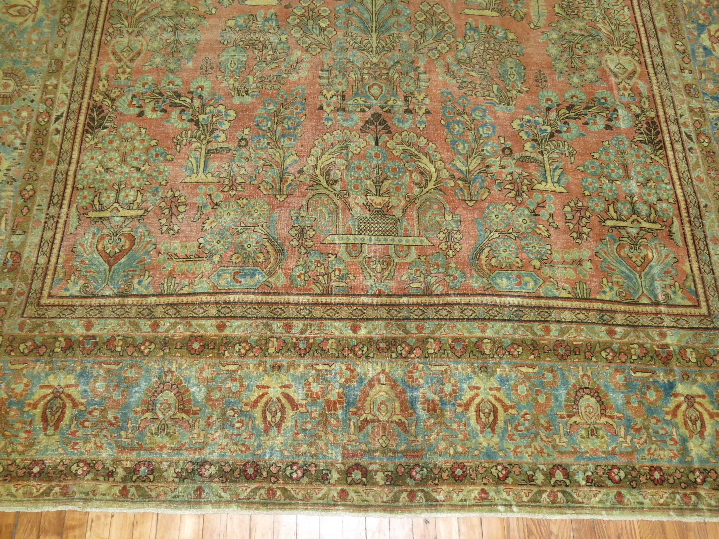 An early 20th century large room size Persian Sarouk rug 

Measures: 9'9'' x 16'3''.

 