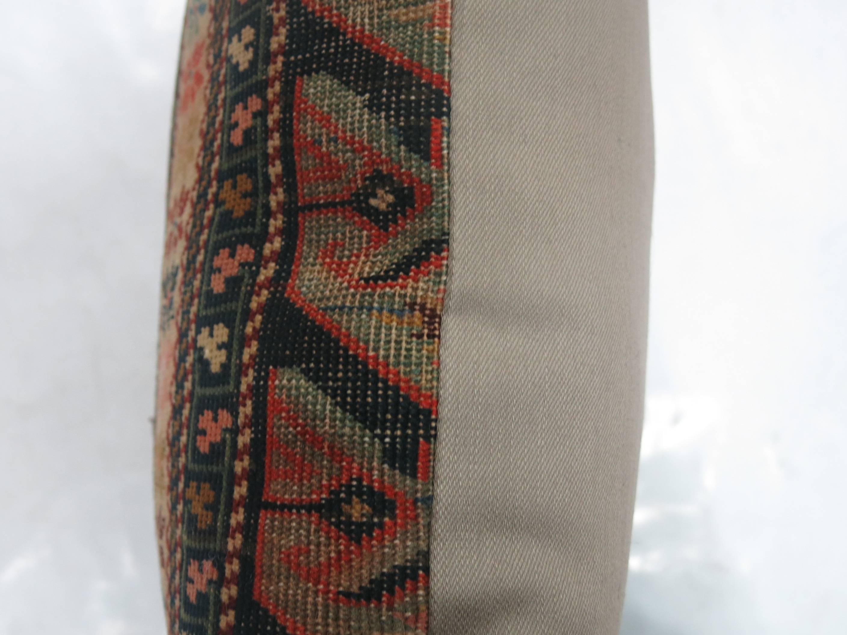 Pillow made from an antique Caucasian rug with cotton back. Zipper closure. Age wear.