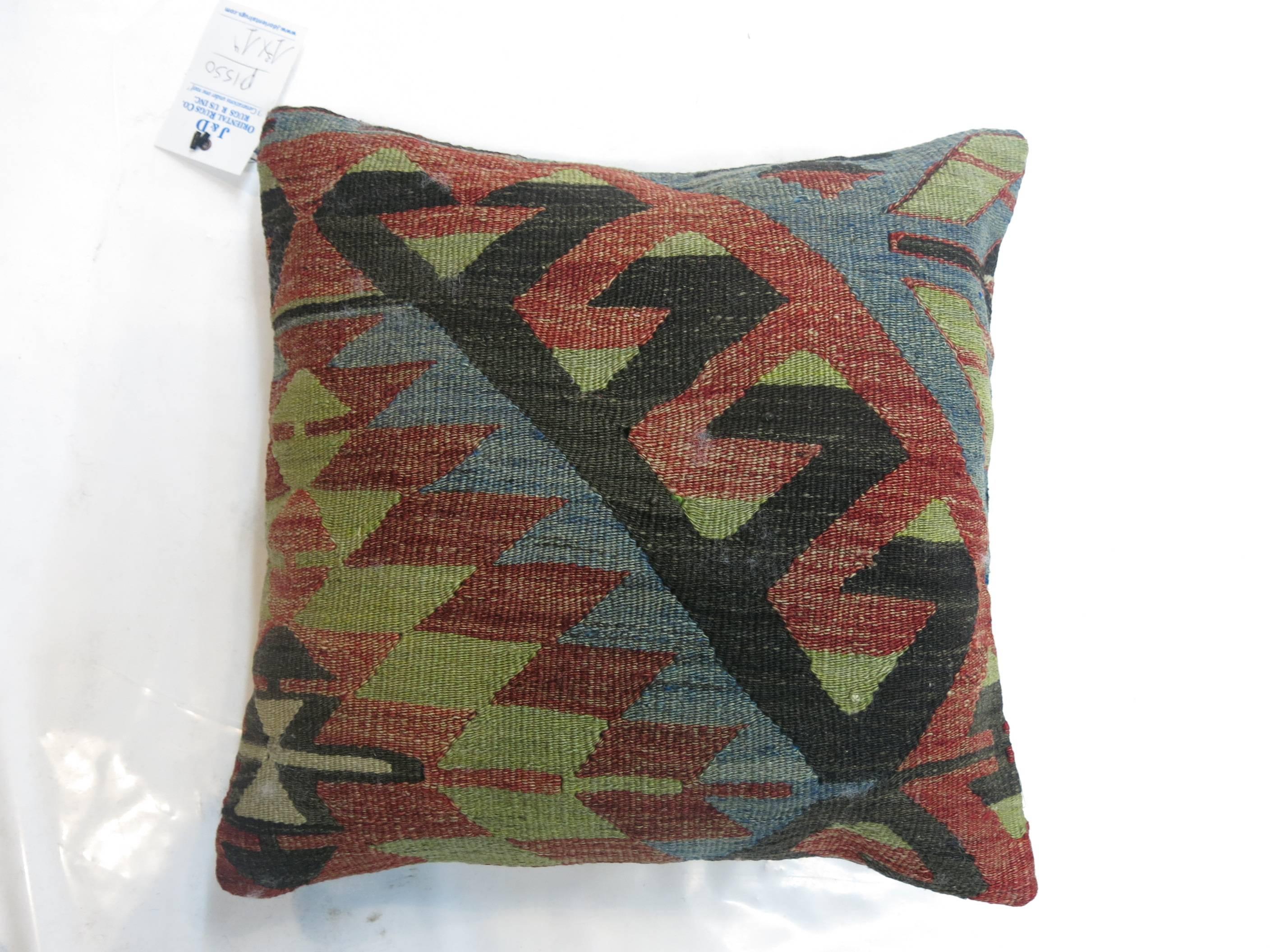 Three complimentary geometric Turkish Kilim pillows. Each piece measures 15'' x 16''. Each piece zipper closure provided.