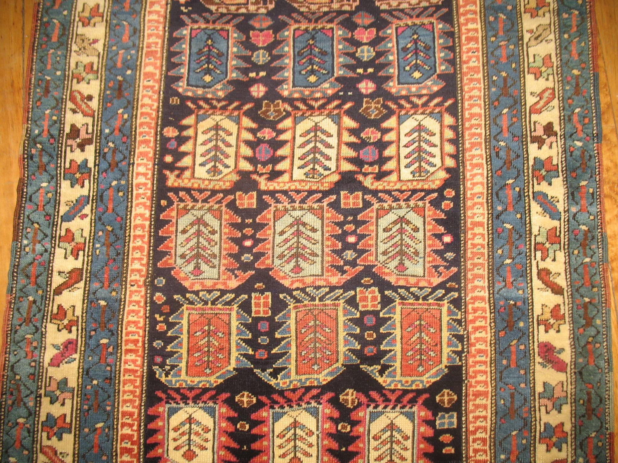 An early 20th century Caucasian runner with an all over boteh/paisley design.