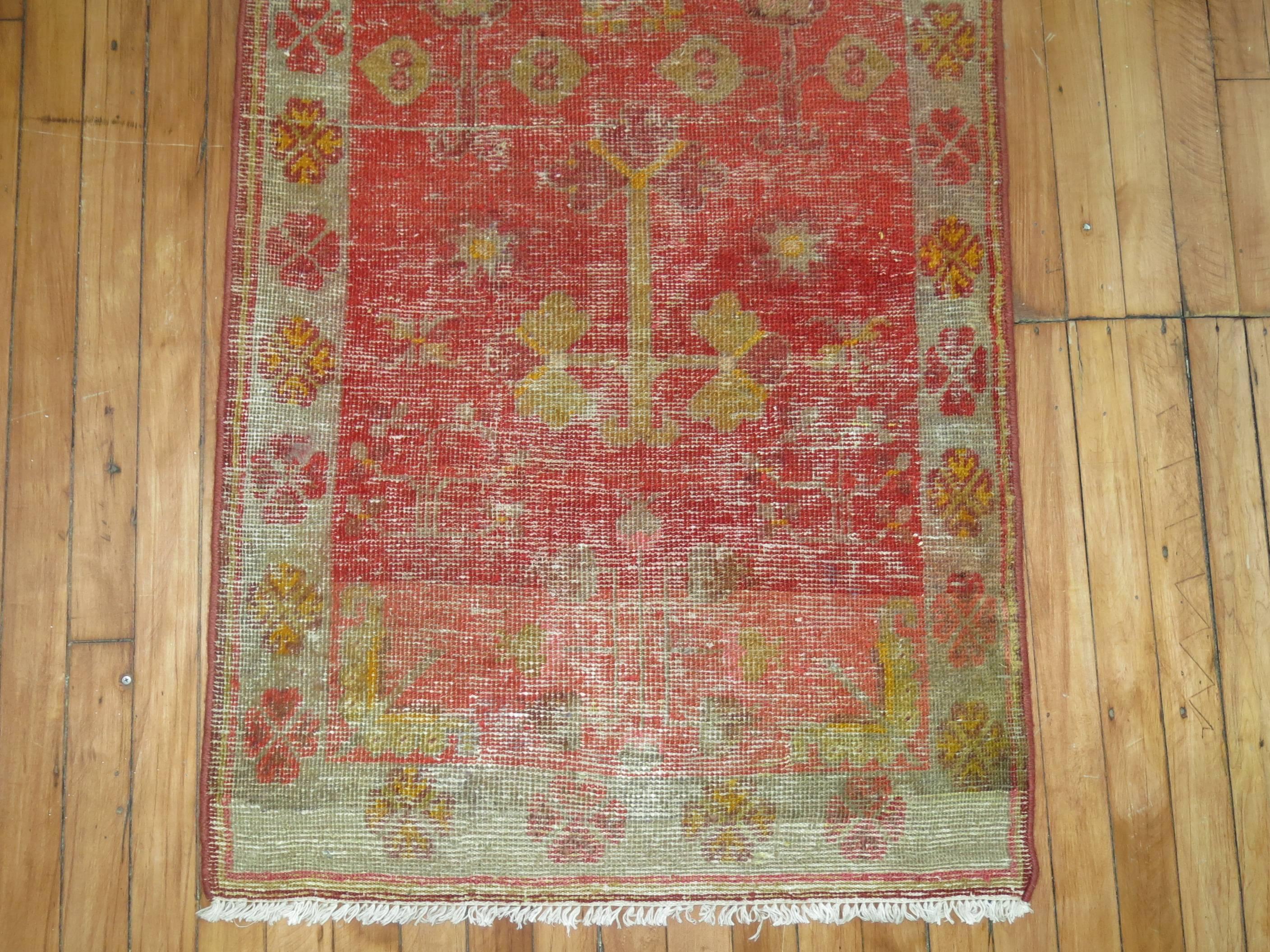 a late 19th century one-of-a-kind worn Antique Khotan runner.

2'5'' x 9'