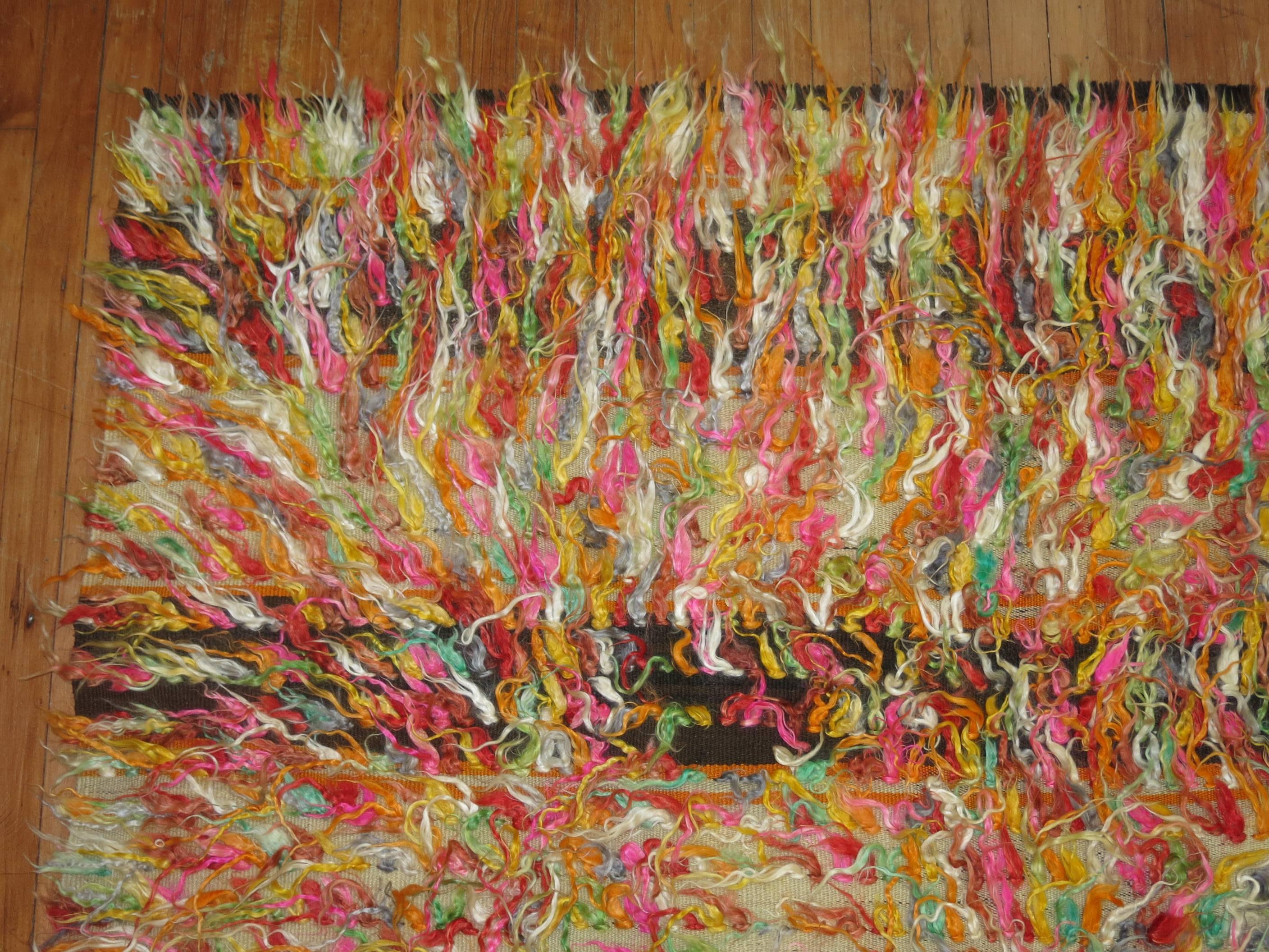 A fun Turkish Tulu rug with a confetti style pattern.