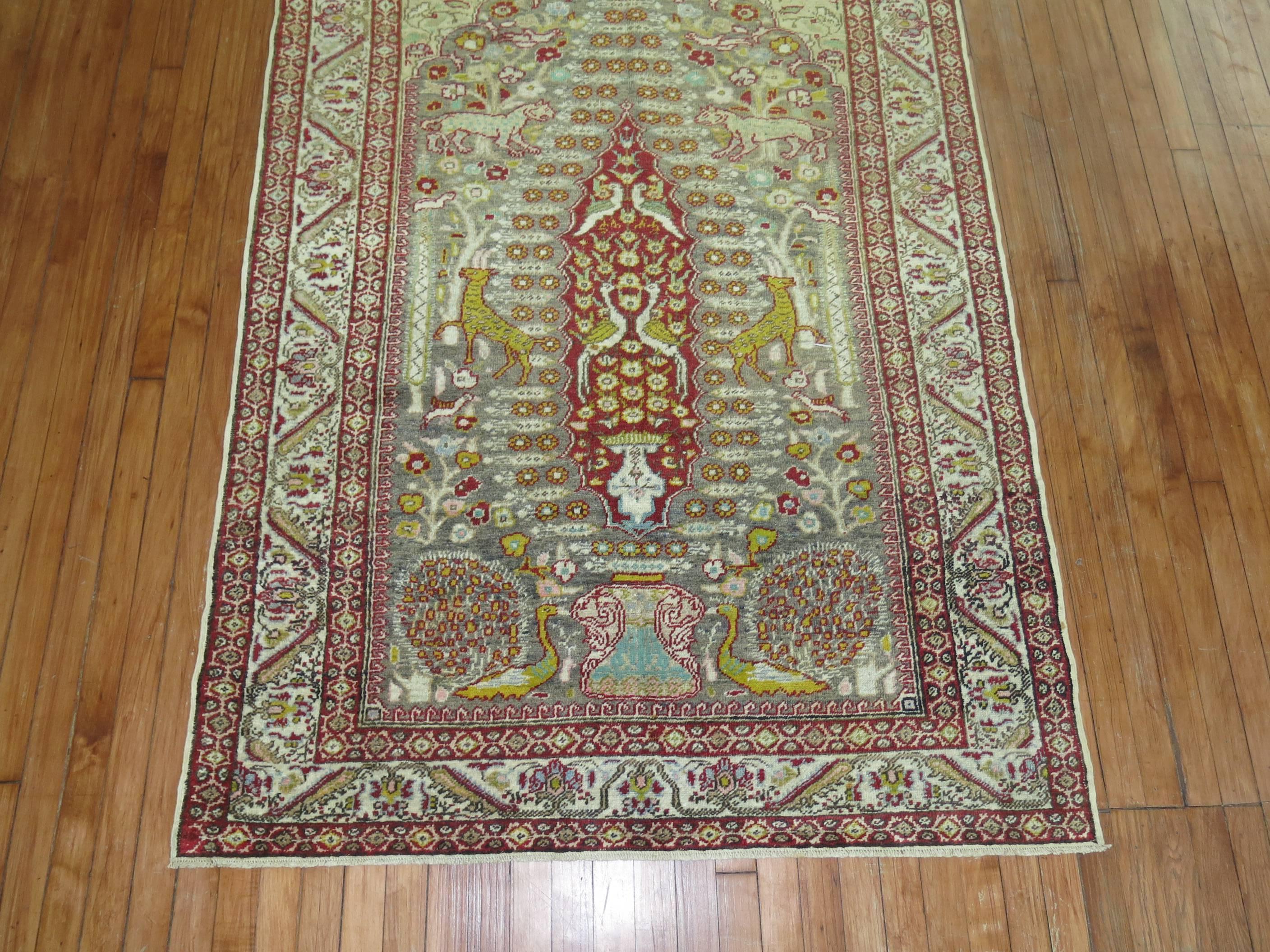 Interesting Turkish rug we purchased depicting different animal figures on a silver colored field.

4'4'' x 7'

Sivas carpets tend to be short cropped copies of Persian carpets. The weavers of Sivas area were predominantly Muslim women. Trade in