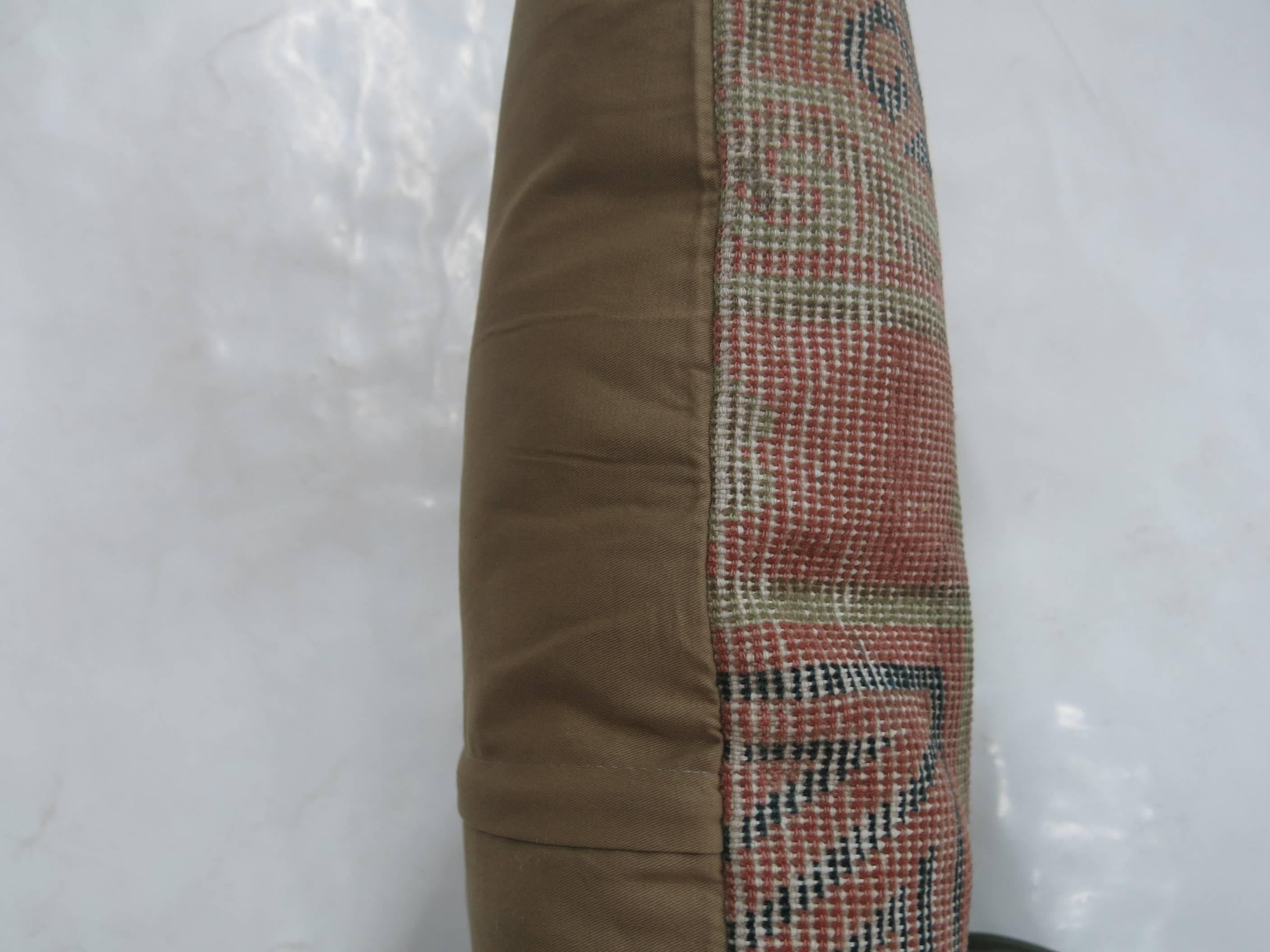 Pillow made from a 19th century antique Khotan rug with cotton back. Zipper closure included.

16'' x 16''