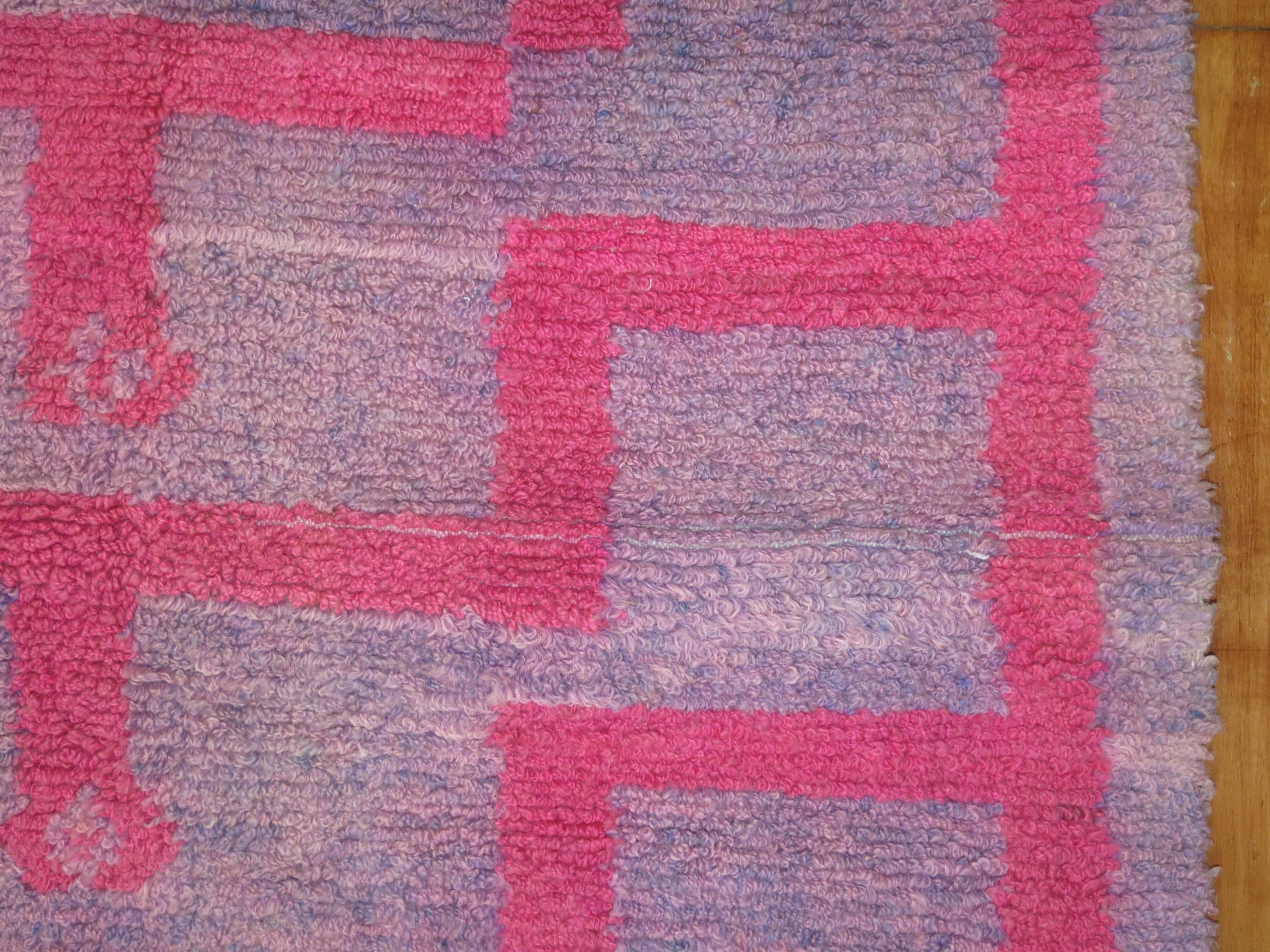 Mid-Century Turkish Tulu carpet with predominant bright pink arch's on an abrashed lavender field with various shades of gray.

3'8'' x 5'1''