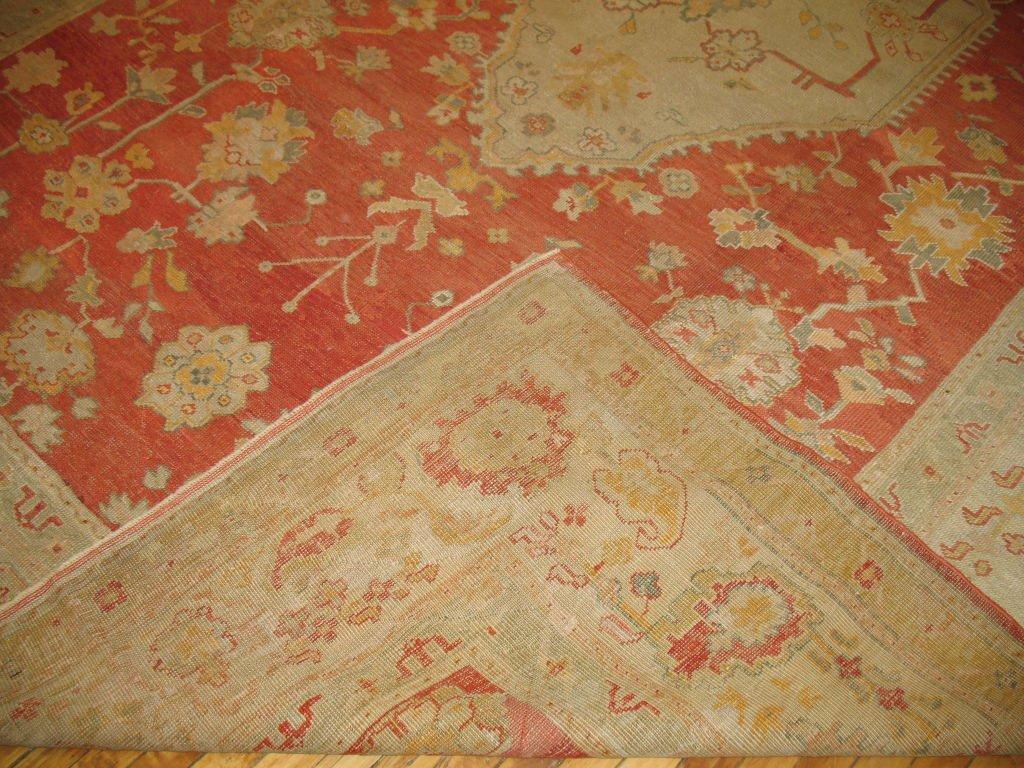 A very fine detailed Turkish Oushak with gold, cream, teal color accents within a coral background. The highest of qualities and a very strong and sturdy rug comparative to other Turkish rugs you see woven from this area.

Until the 18th century,
