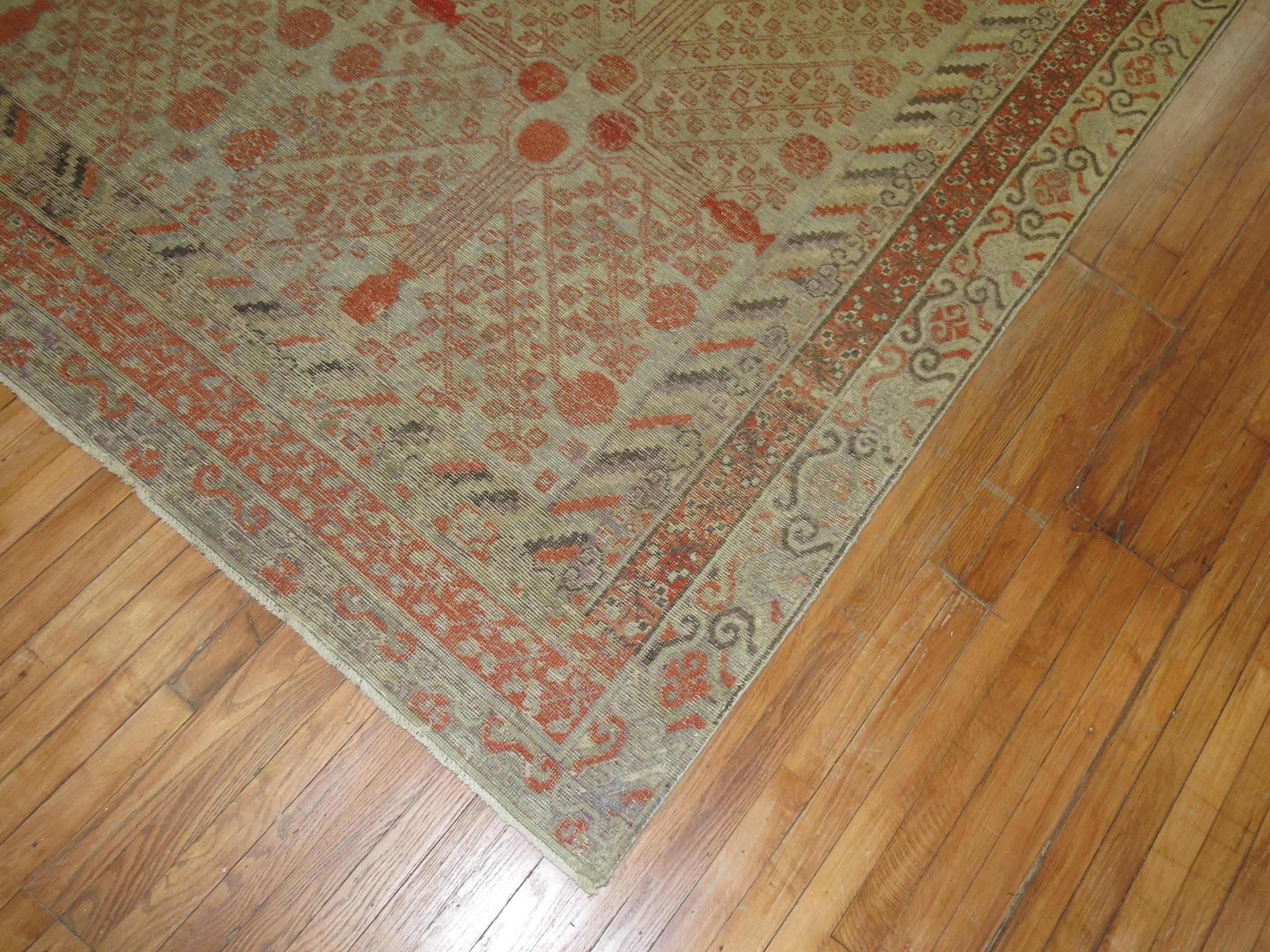 Large Shabby Chic Antique Khotan Rug, Late 19th Century In Distressed Condition In New York, NY