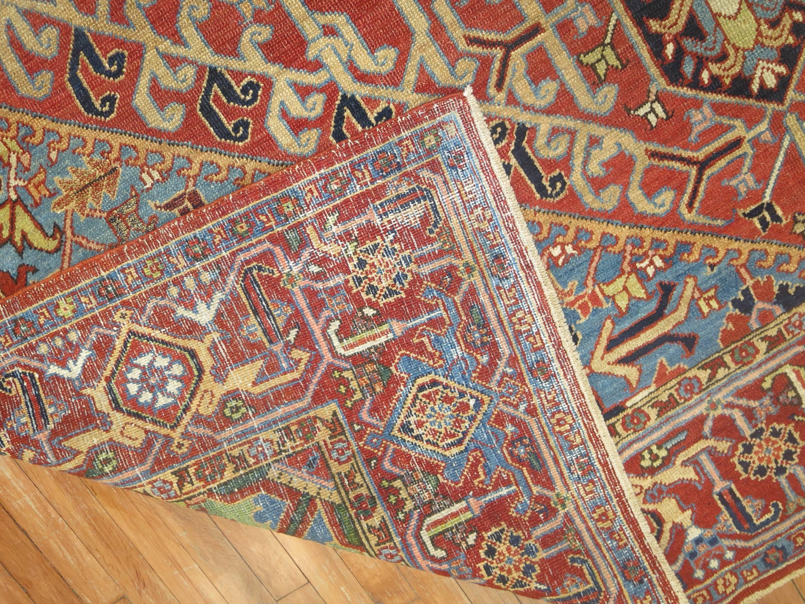 Delightful colorful early 20th century room size Persian Heriz carpet. The color combo on this is phenomenal.

Measures: 8'7'' x 11'6''.