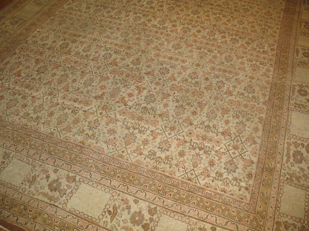 A nice decorative Persian Tabriz rug, all-over herati pattern with a highly unusual border. Soft tan field with browns and pinks.
