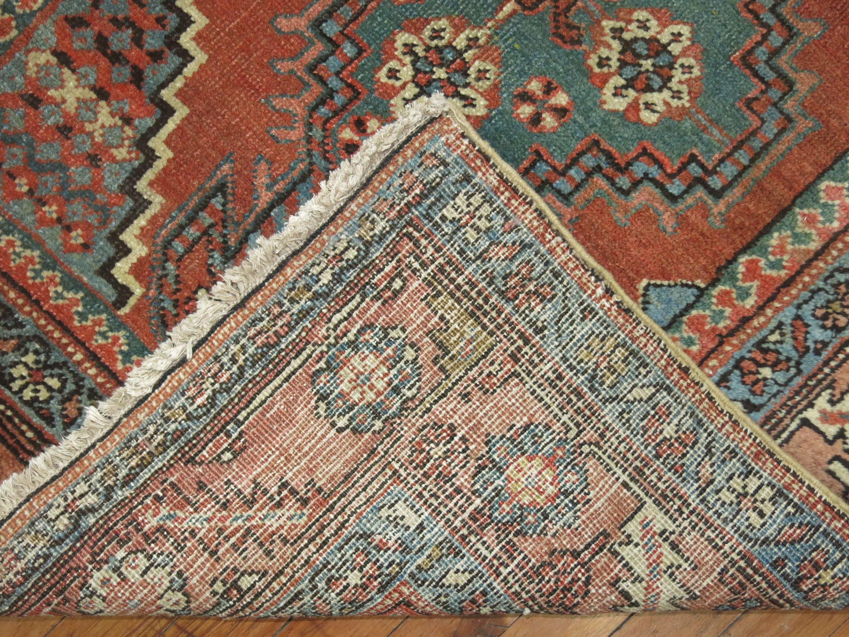 A hard to find, authentic one-of-a-kind antique Persian Heriz wide runner in rustic tones.