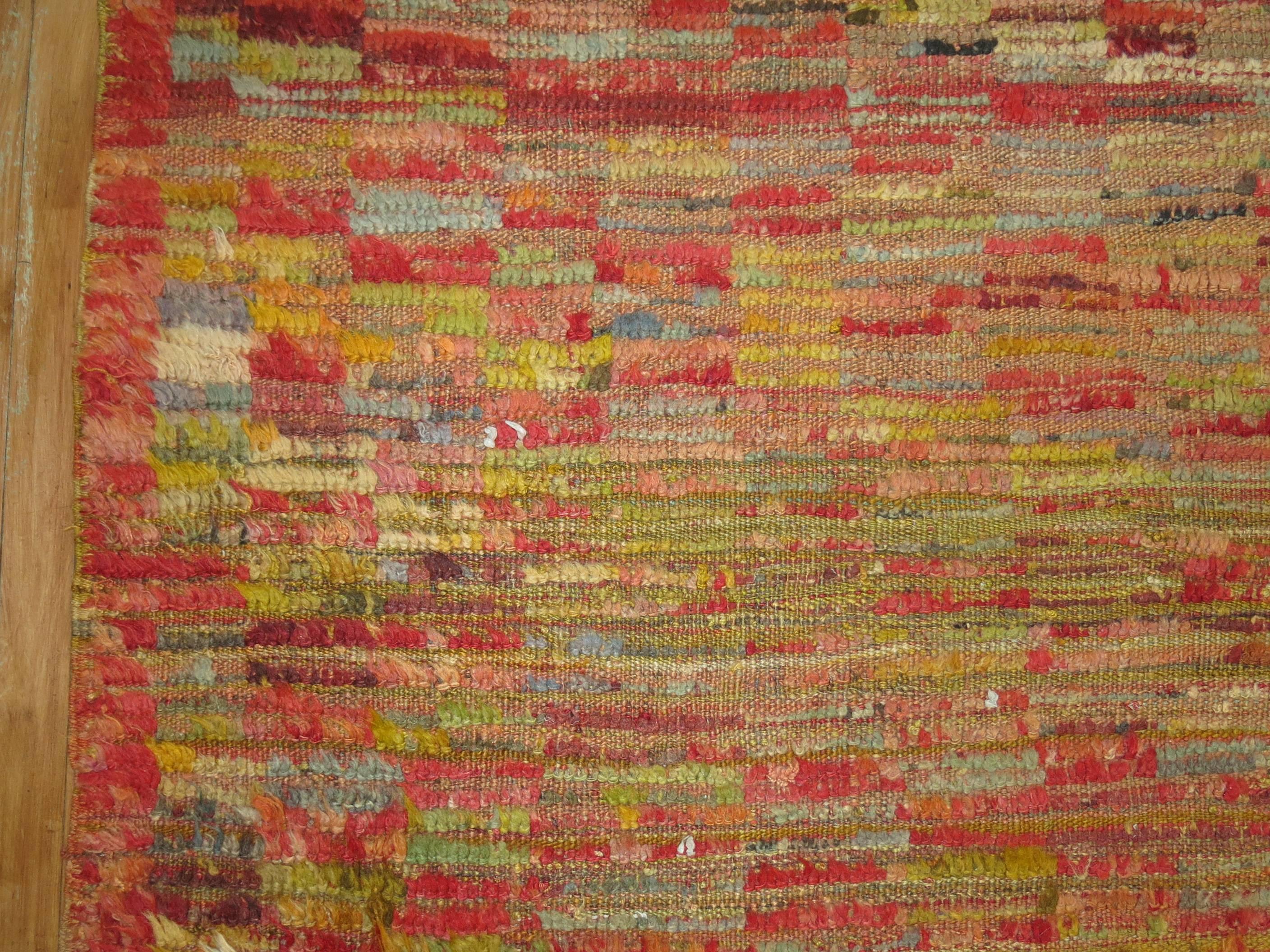 A fun and colorful Mid-Century Turkish Tulu rug with an all-over checkerboard motif.