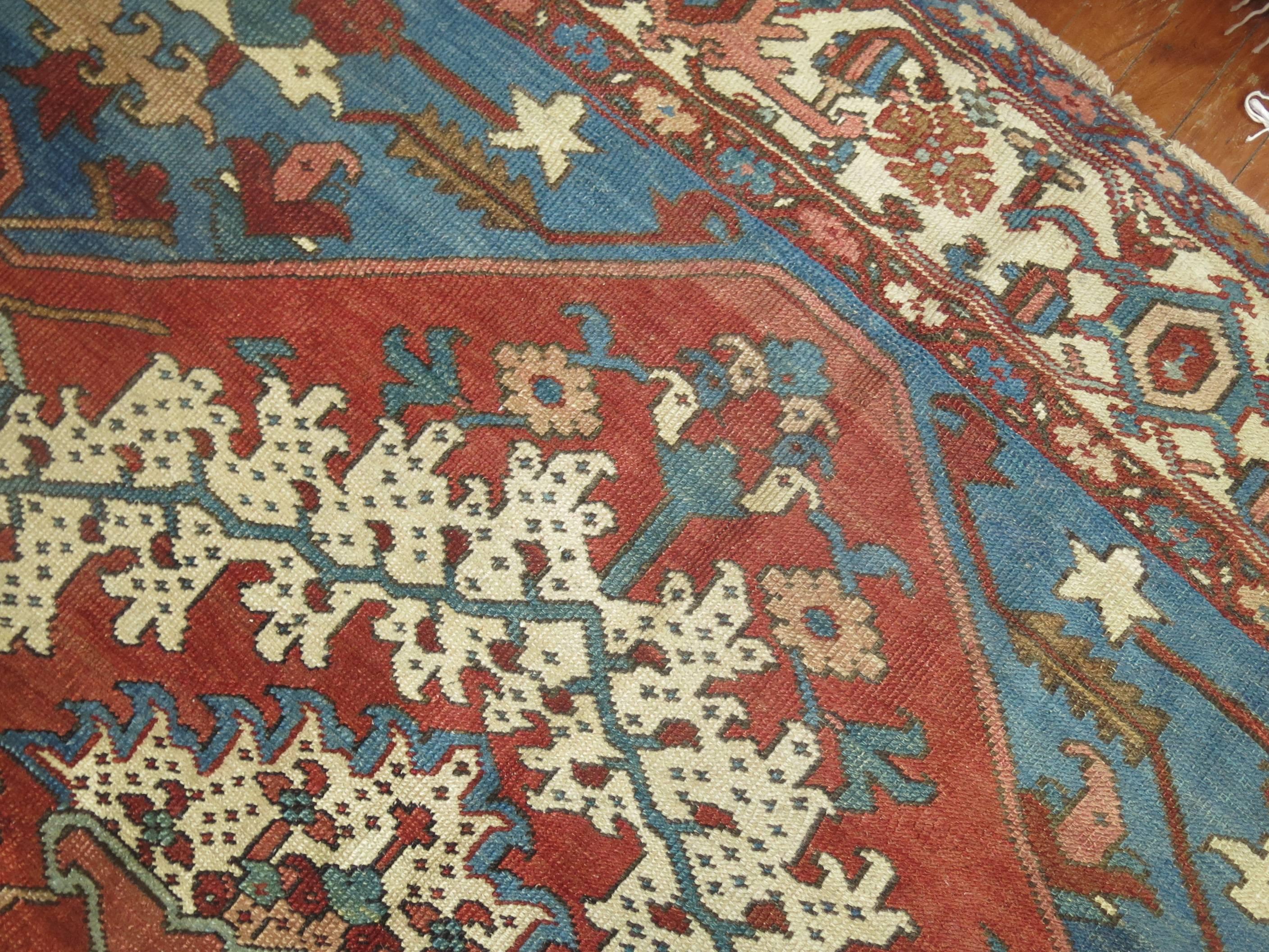 Incredible one of a kind Persian Serapi Bakshaish rug in rusts, blues and creams.

The best Bakshaish carpets offer a unique combination of geometric allover design or graphic or tribal medallion formats with unparalleled use of natural color and